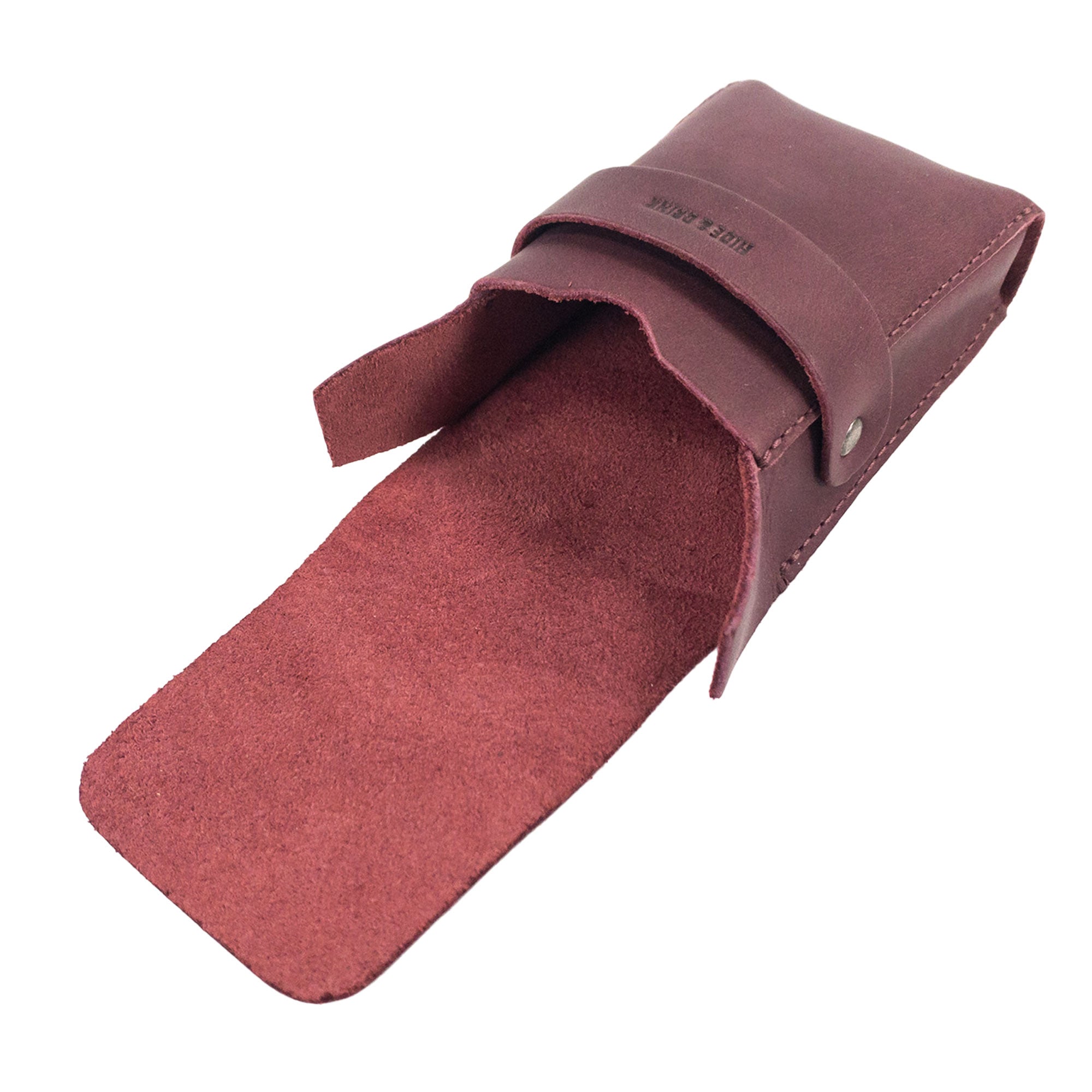 Open view of Hide & Drink's burgundy Playing Card Case, revealing its spacious interior. This handcrafted travel accessory serves as a classic case for playing cards (not included), ensuring secure storage. Made of full grain leather, it embodies artisan techniques from StockyardX.