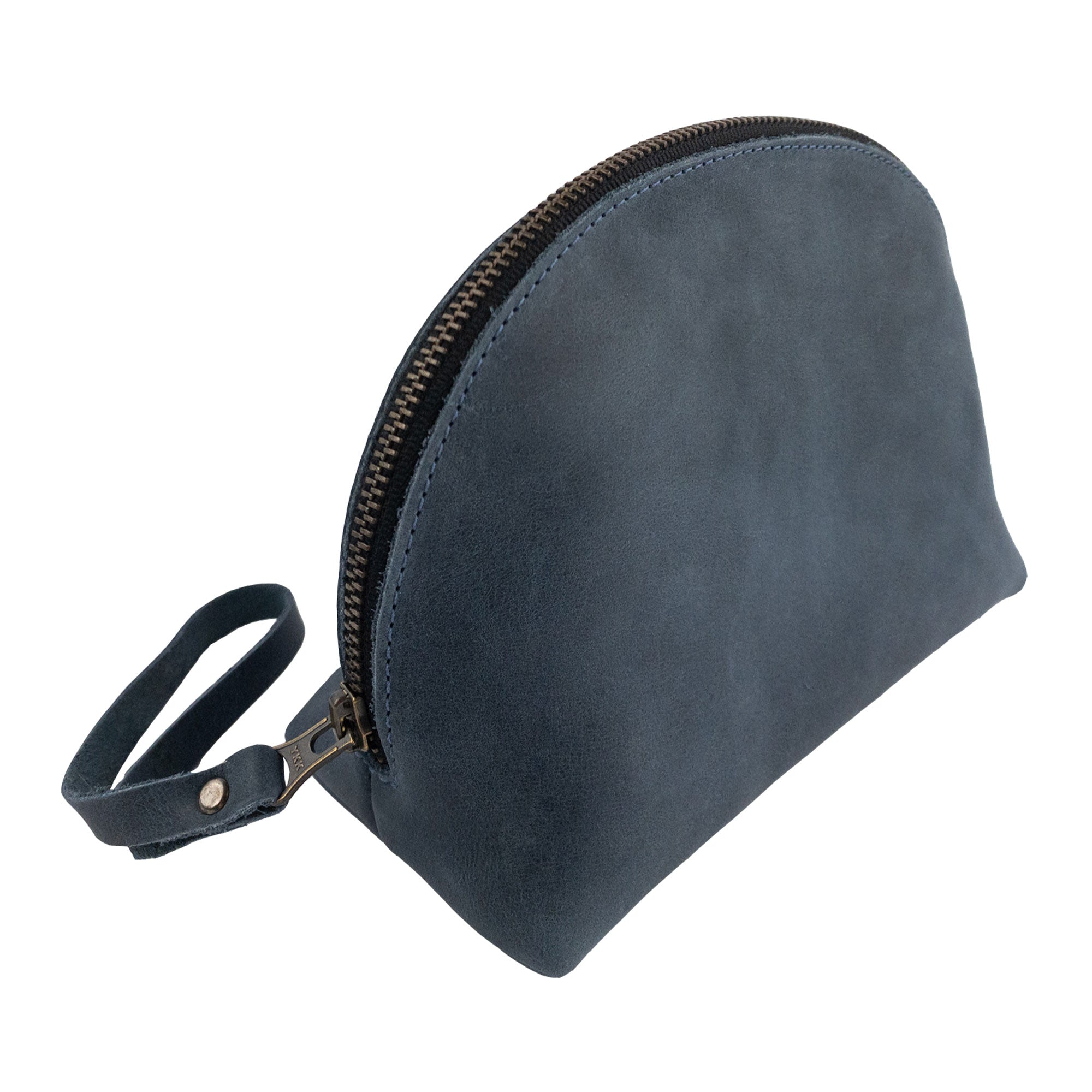 A side view of the Accessory Pouch Organizer Hand Bag by Hide & Drink, showcasing brown full grain leather and zipper detail. Perfect as a Cosmetic Travel Organizer with Hand Strap for Women, it works well as a Makeup Bag and Classic Handbag, highlighting artisan quality from La Antigua Guatemala & Oaxaca Mexico.