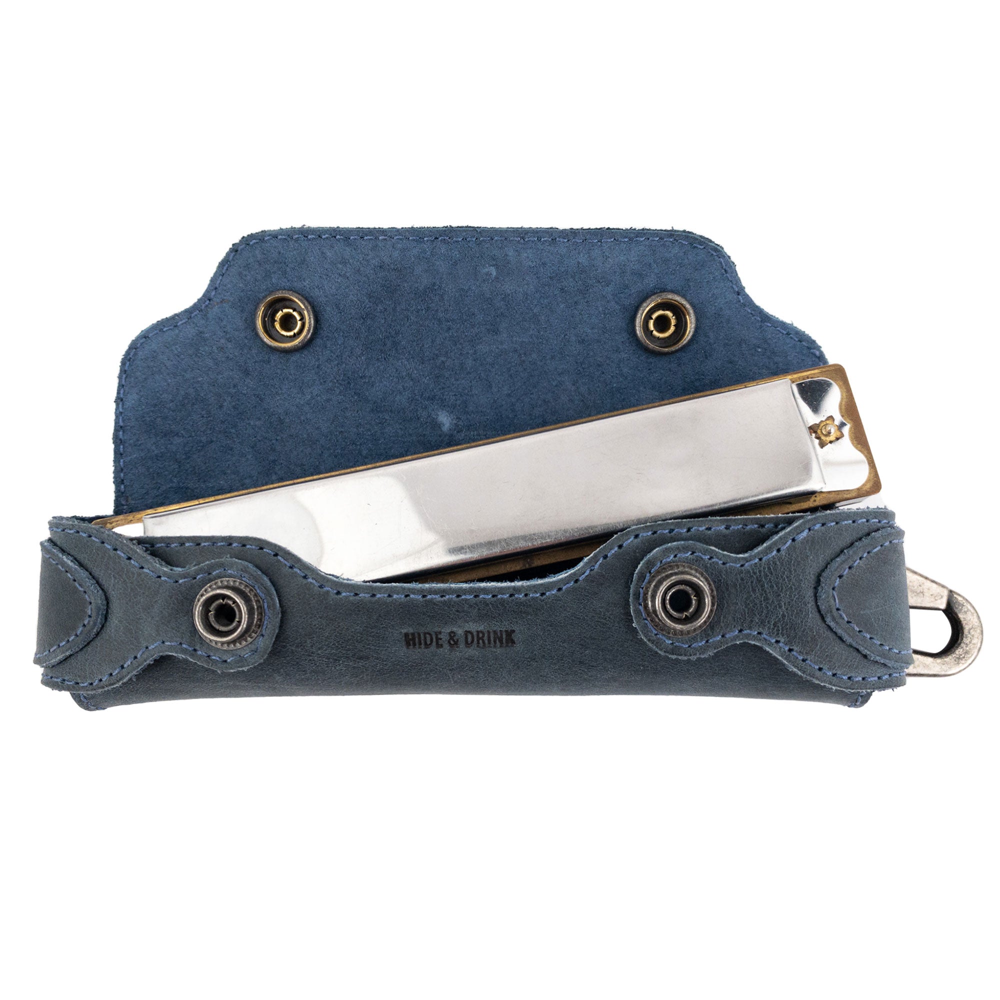 Harmonica Case featuring harmonica inside, demonstrating the perfect fit. This blue case from Hide & Drink, crafted from full grain leather, is designed for musicians seeking functionality and style, reflecting artisan craftsmanship.