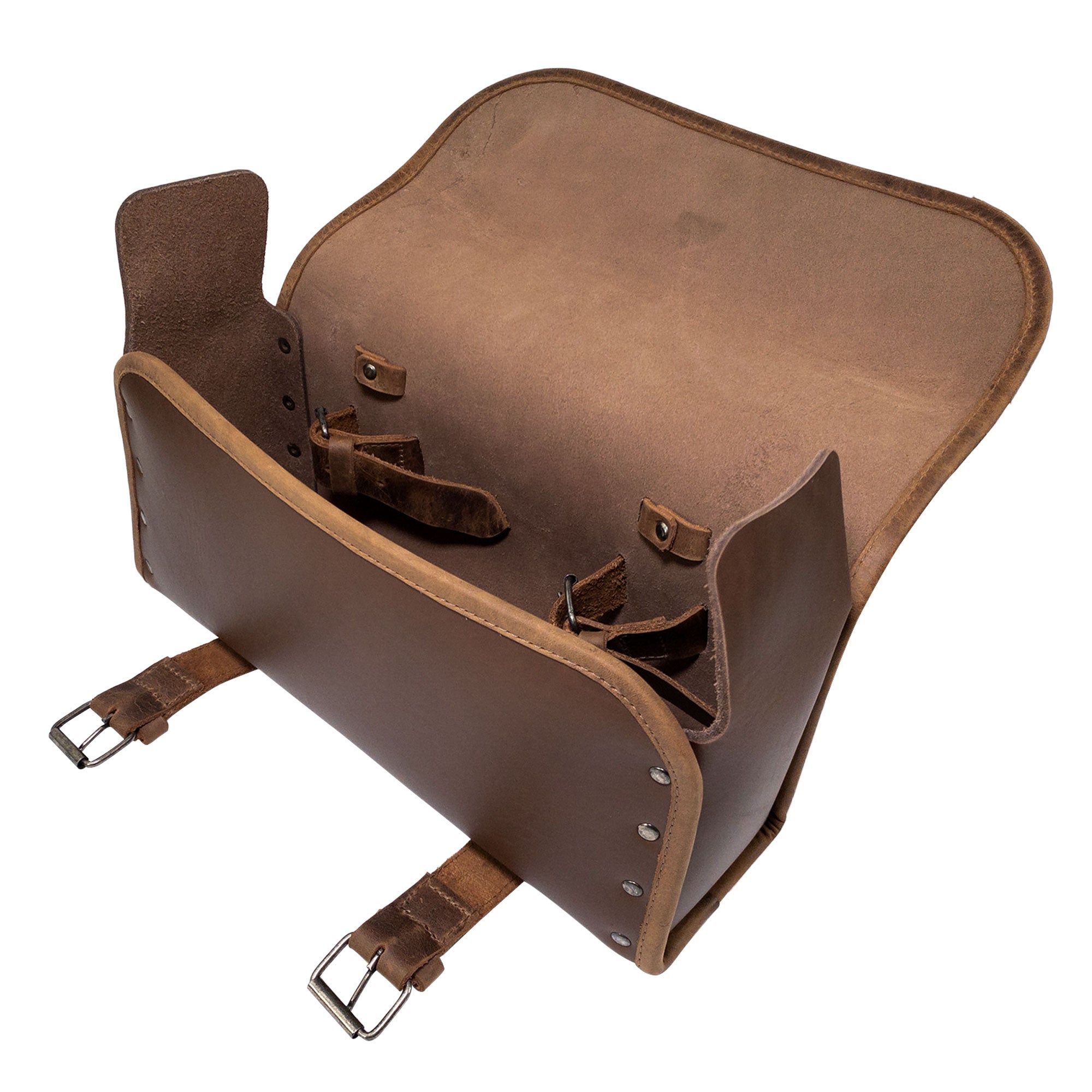 Interior view of the Riveted Bag for Motorcycle by Hide & Ride, showing spacious storage compartment and adjustable straps. This Motorcycle Riveted Bag is an essential biker accessory, made from hand cut full grain leather, and embodies the artisan spirit of small batch production in La Antigua Guatemala & Oaxaca Mexico.
