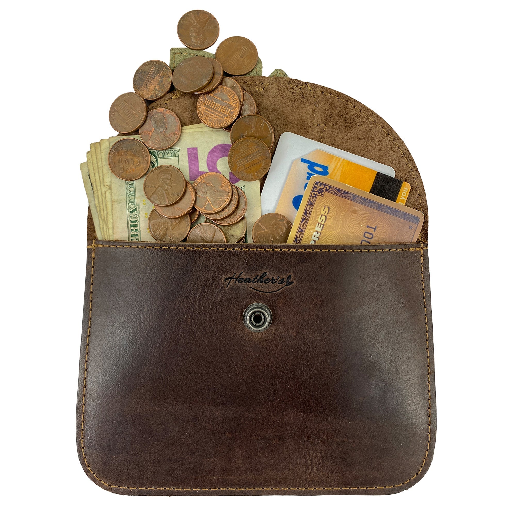 Heather's Leaf Card Wallet filled with cash and coins, demonstrating its practical use as a soft organizer. This Leaf Card Wallet is perfect for holding coins, cash, and cards, acting as both a cable holder and phone & accessories case. Handcrafted from full grain leather, it reflects small batch artisan production.