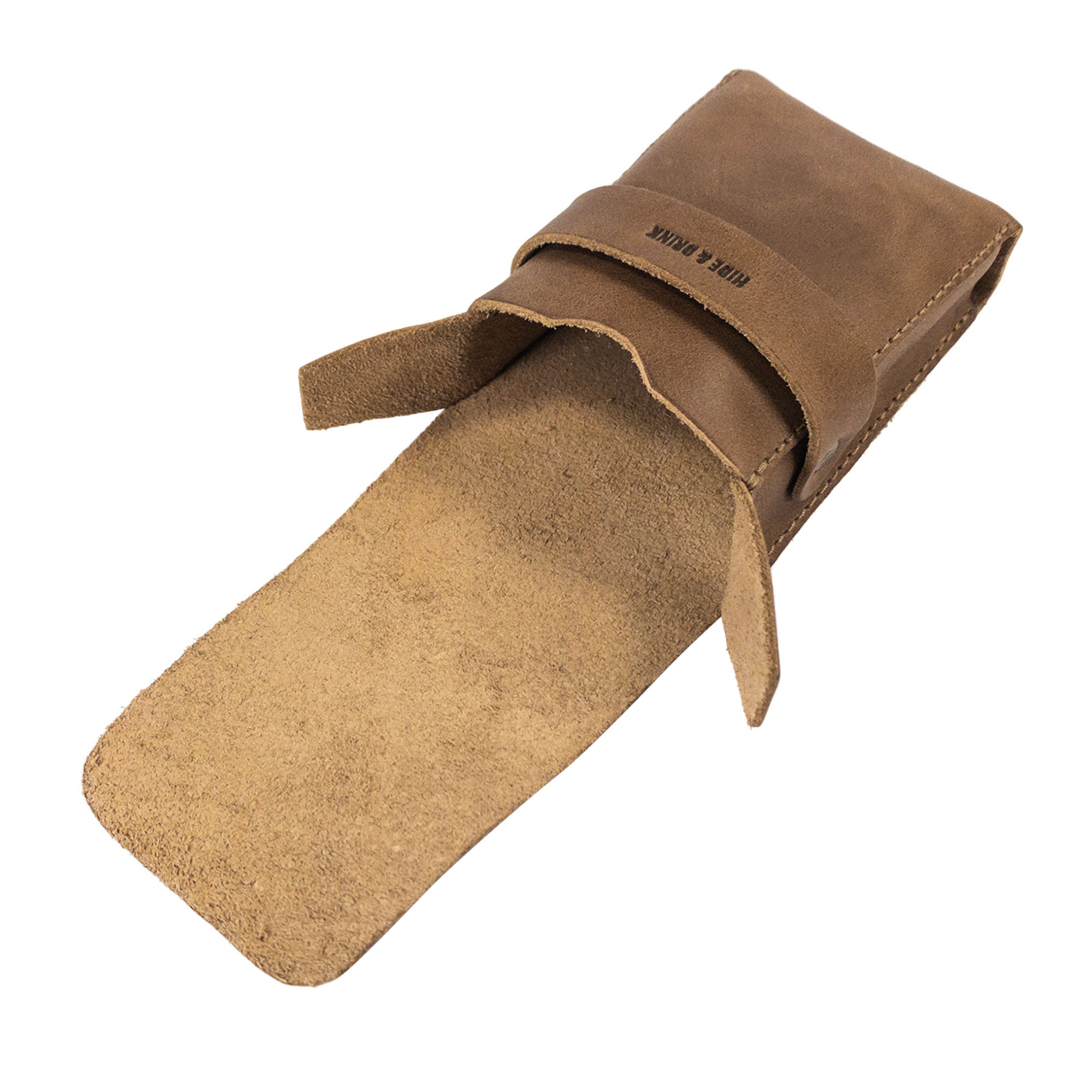 Open view of Hide & Drink's brown Playing Card Case, showing its interior space for storage. Ideal for securely holding classic playing cards (not included), this travel accessory features full grain leather and artisan quality craftsmanship from StockyardX for card enthusiasts.