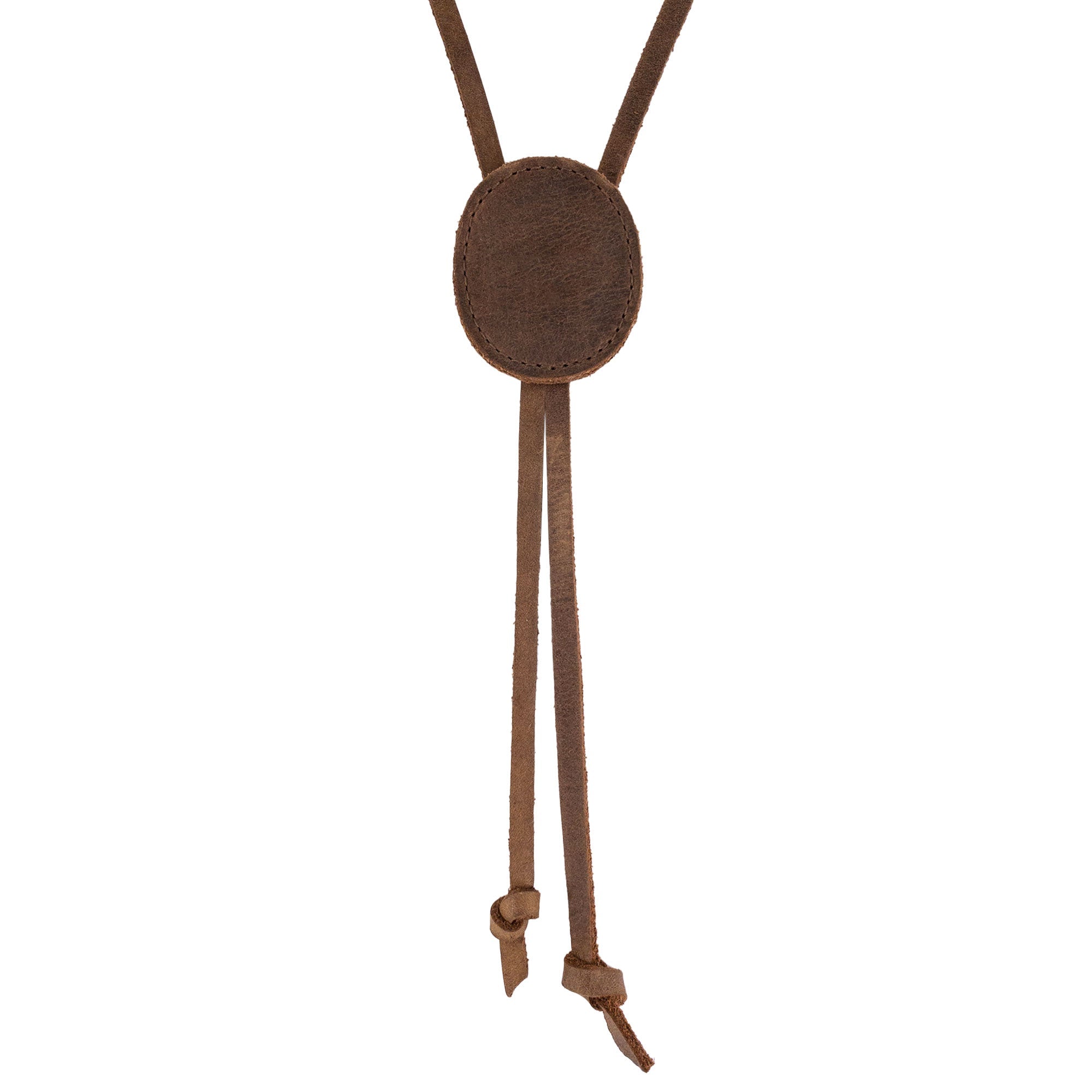 Close-up of a Cowboy Bolo Tie from Western Leather Works featuring a round shape crafted from full grain leather. A testament to small batch production, this hand cut and hand sewn accessory is artisan quality, handmade in La Antigua Guatemala & Oaxaca Mexico.