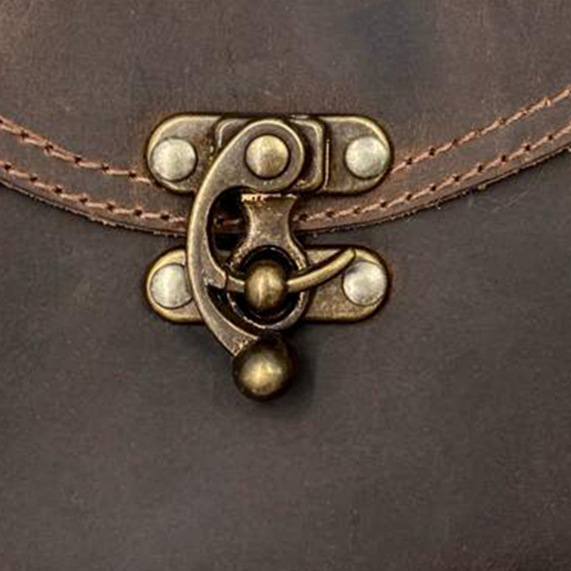 Close-up of the vintage clasp on the Vintage Clutch Bag by Hide & Drink, highlighting the Full Grain Leather design. An example of artisan craftsmanship from small batch production in Oaxaca Mexico.