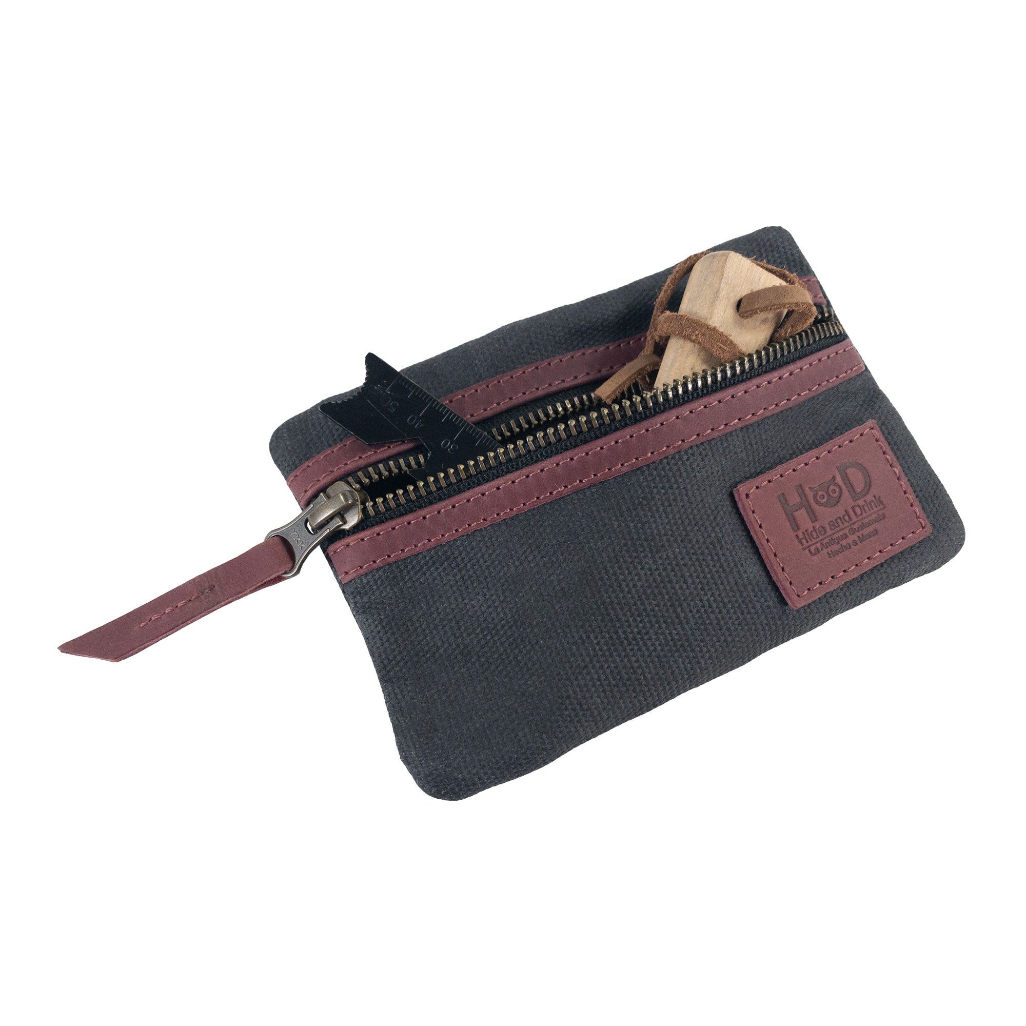 Open teal Multi-tool Pocket Pouch by Hide & Drink, designed to hold various tools and everyday items effectively.