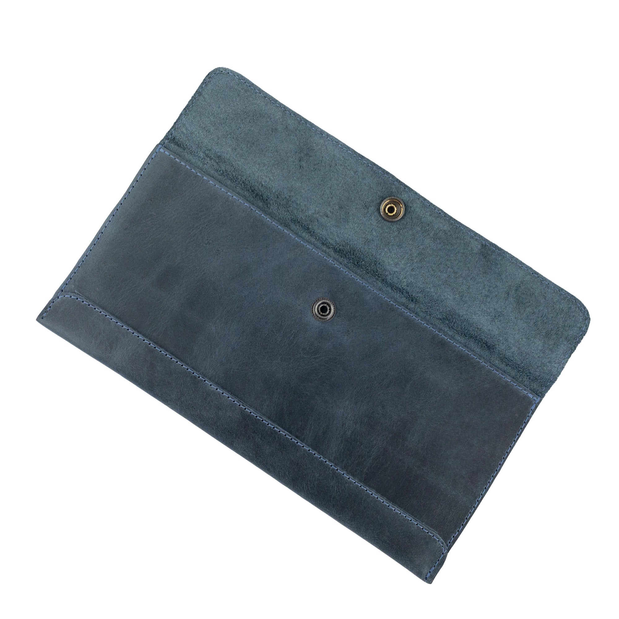 Open view of Hide & Drink's navy blue Travel Hand Wallet, highlighting its organized compartments, crafted with Full Grain Leather. This Travel Wallet showcases artisan craftsmanship made in La Antigua Guatemala & Oaxaca Mexico.
