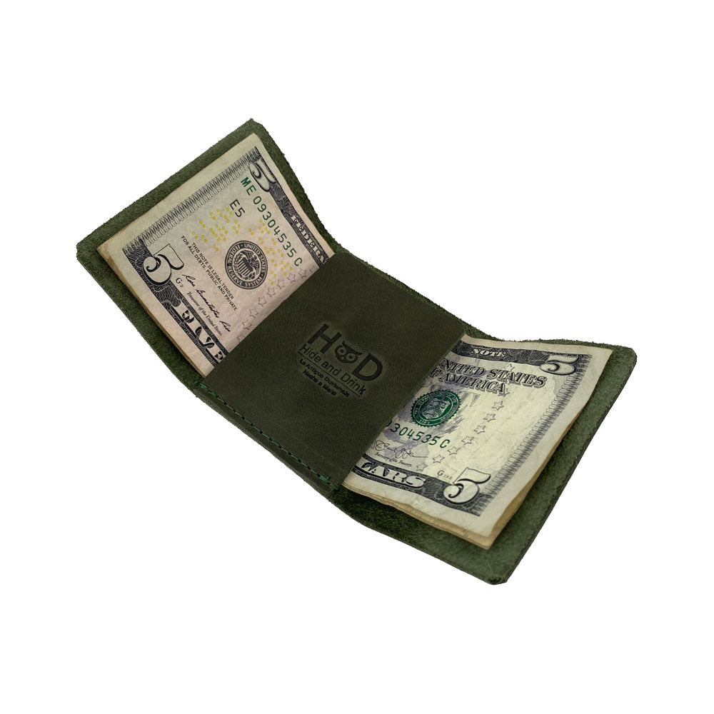 A stylish presentation of the Hide & Drink Minimalist Wallet Bills Only displaying its simple, elegant design. This Ultra Minimalist Wallet in Full Grain Leather makes for an ideal cash organizer, reflecting the artisan craftsmanship from La Antigua Guatemala.