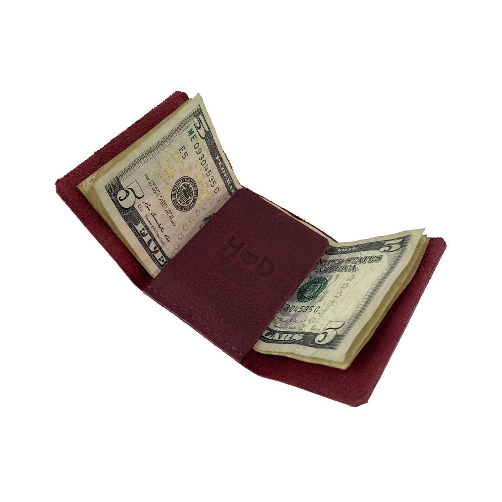 A different perspective of the Hide & Drink Minimalist Wallet Bills Only, emphasizing its craftsmanship in Full Grain Leather. This Ultra Minimalist Wallet functions as an effective cash organizer, showcasing hand sewn artistry from La Antigua Guatemala.