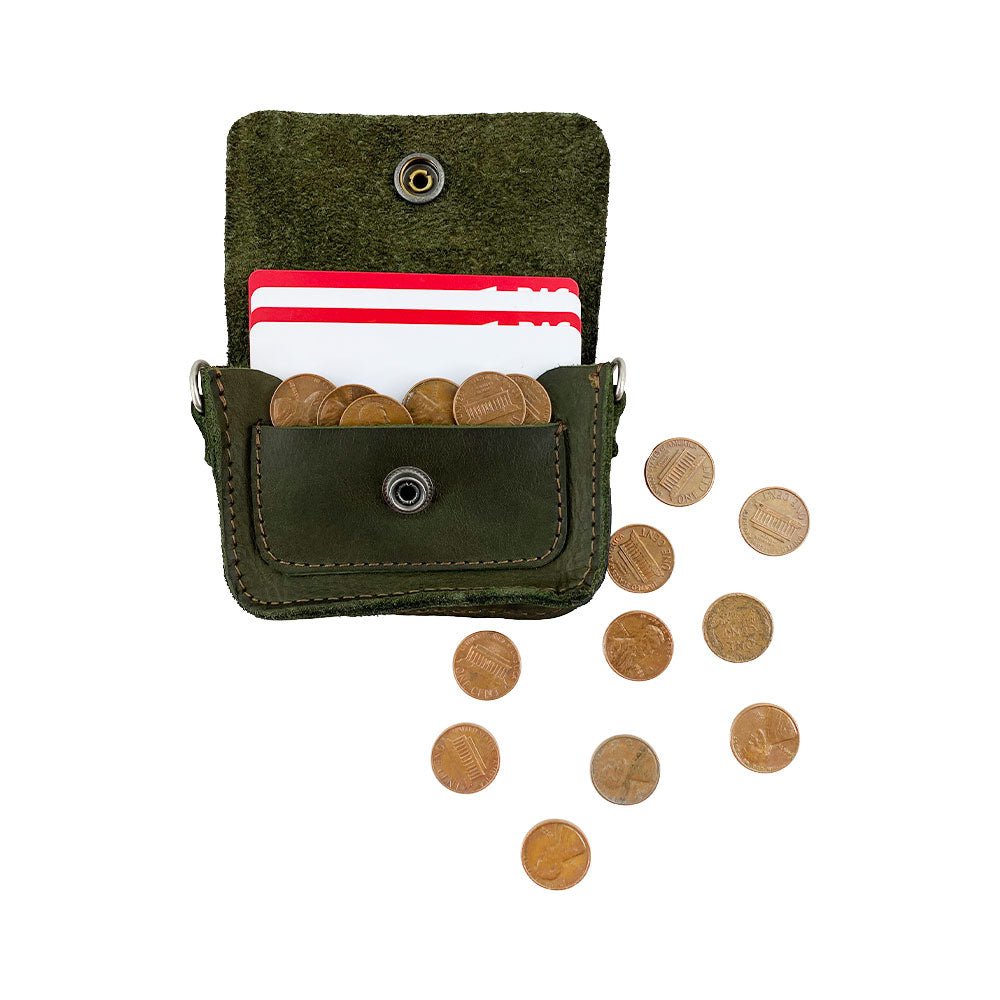 Hide & Drink's Card Holder Briefcase Style, presenting the Mini Briefcase Card Holder alongside coins. This Full Grain Leather case holds up to 10 cards and folded bills, serving as an organized cash holder crafted through small batch production.