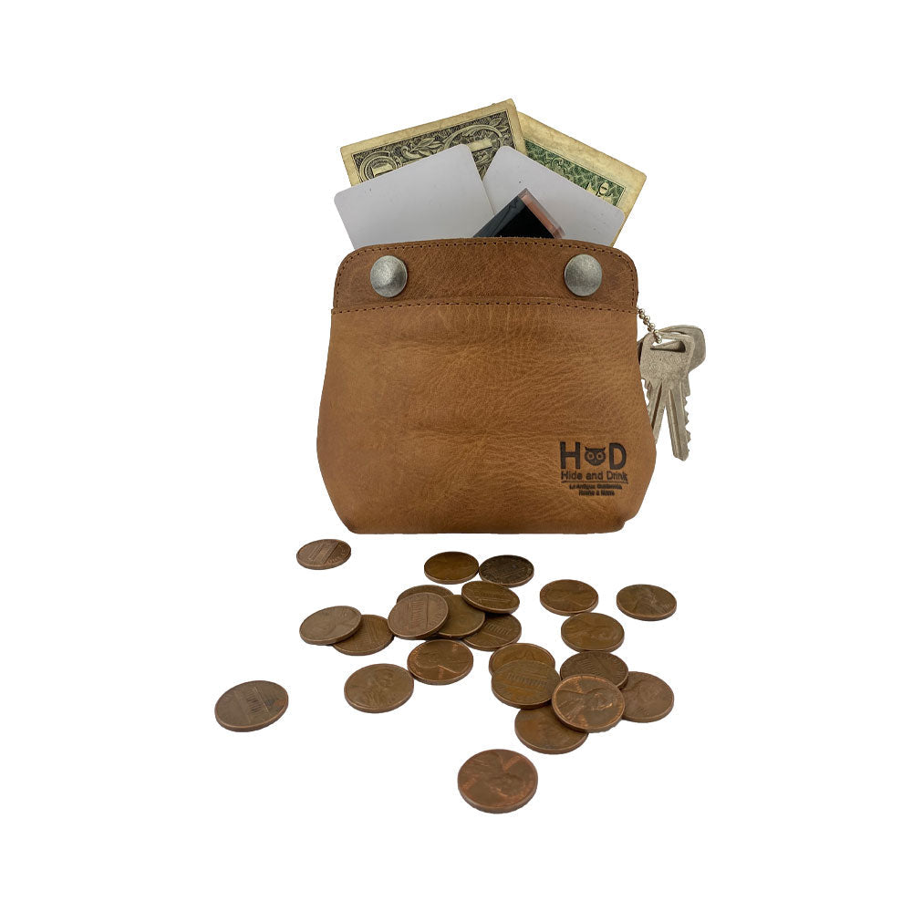 Hide & Drink Double Snap Pouch filled with cash and keys, showcasing its multi-use functionality as a coin purse and cash organizer. Handcrafted in La Antigua Guatemala from full grain leather for lasting durability.