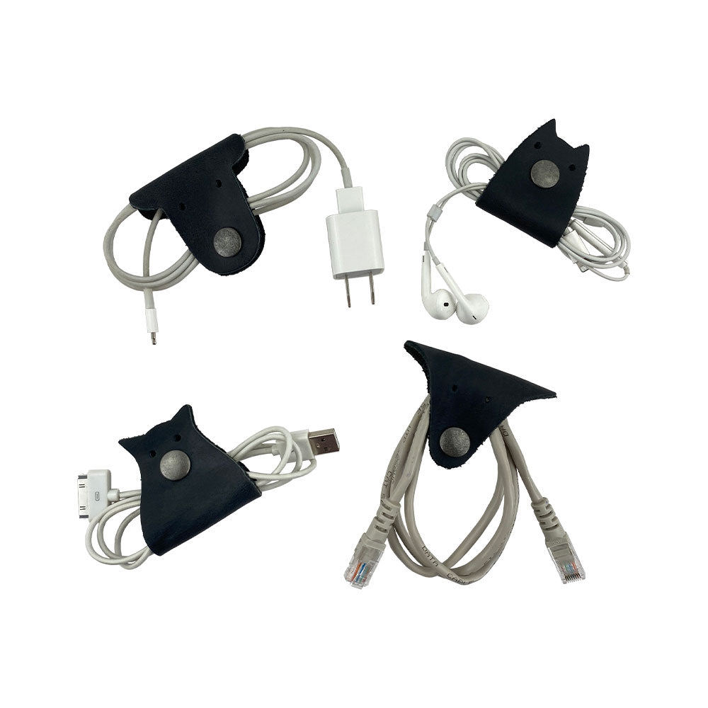 Furry Friends Cord Keeper (4-Pack), featuring fun animal shapes crafted from premium full grain leather by Hide & Drink to keep cables neat and organized. Furry Friends 4-Pack Cord Keeper (Cord Clam), Full Grain Leather, StockyardX, Small Batch Production, Hand Cut, Hand Sewn, Fire Branded, Artisan, Handmade in La Antigua Guatemala & Oaxaca Mexico.