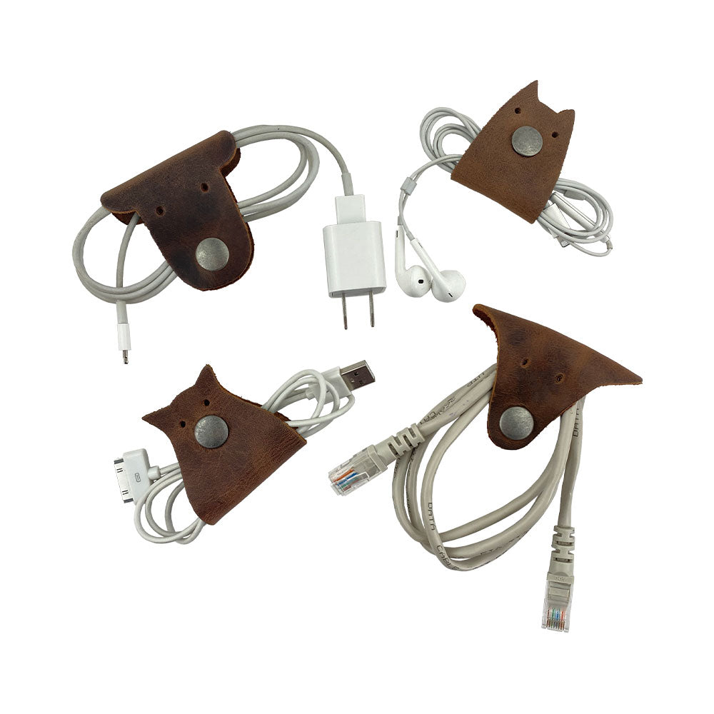 Furry Friends Cord Keeper (4-Pack) featuring fun animal shapes, crafted from premium full grain leather by Hide & Drink, ideal for stylish cable organization. Furry Friends 4-Pack Cord Keeper (Cord Clam), Full Grain Leather, StockyardX, Small Batch Production, Hand Cut, Hand Sewn, Fire Branded, Artisan, Handmade in La Antigua Guatemala & Oaxaca Mexico.
