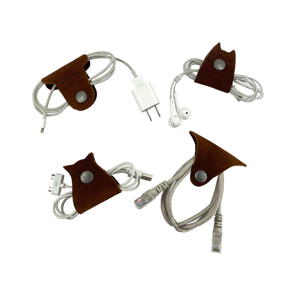 Furry Friends Cord Keeper (4-Pack) displaying cute designs to keep cords tidy, made from high-quality Full Grain Leather by Hide & Drink. Furry Friends 4-Pack Cord Keeper (Cord Clam), Full Grain Leather, StockyardX, Small Batch Production, Hand Cut, Hand Sewn, Fire Branded, Artisan, Handmade in La Antigua Guatemala & Oaxaca Mexico.