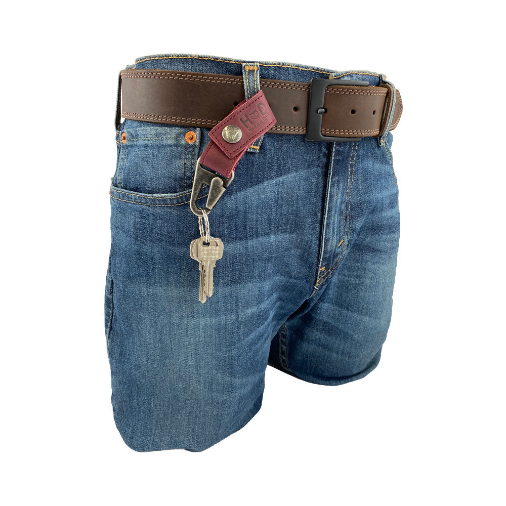 Another view of the Key Ring Holder from Hide & Drink, emphasizing its rustic charm and durability as it holds keys with an attractive leather strap. Key Ring Holder, Full Grain Leather, StockyardX, Small Batch Production, Hand Cut, Hand Sewn, Fire Branded, Artisan, Handmade in La Antigua Guatemala & Oaxaca Mexico.