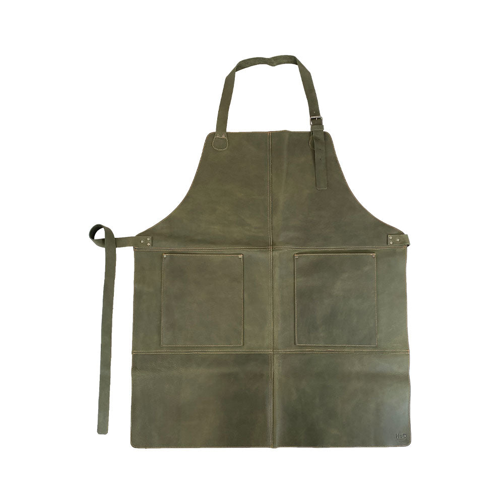 Front view of the Hide & Drink Leather Apron, rich green in color with large pockets for tools, demonstrating its full grain leather craftsmanship. A stylish and functional Leather Apron for all artisans.