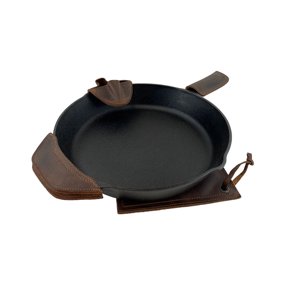 Hide & Drink Hot Handle Holders (Set of 4)—this image clearly highlights the Panhandle, Side Kick, Grip Mitt, and Square Pot Holder. Each piece is expertly made from durable Full Grain Leather, ensuring longevity. These artisan products emphasize small batch production sculpted with love, hand cut and hand sewn in La Antigua Guatemala & Oaxaca Mexico.