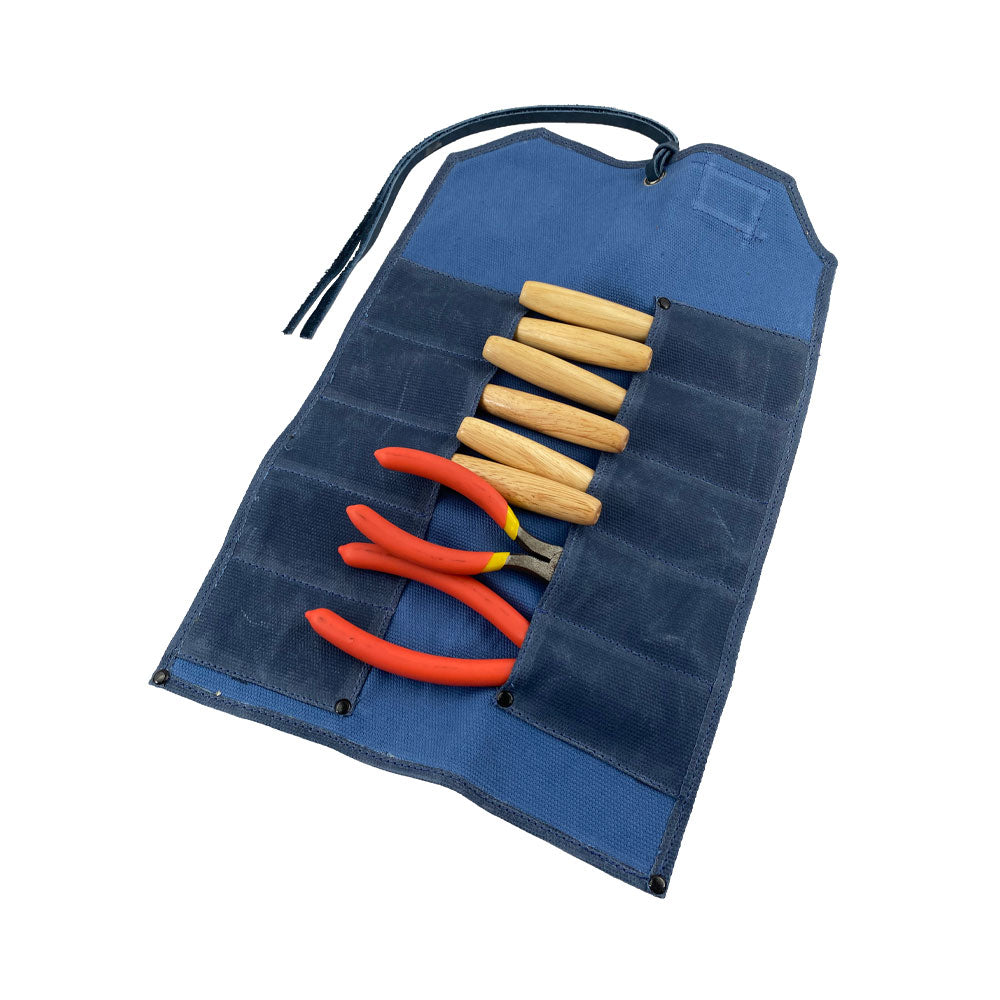 Hide & Drink Tool Roll features a stylish small tool roll-up bag with 10 slots, designed from quality full grain leather. This portable carry-on pouch enhances woodworking tools organization, making it a great addition to any workshop storage system. Handcrafted by artisans in La Antigua Guatemala & Oaxaca Mexico.
