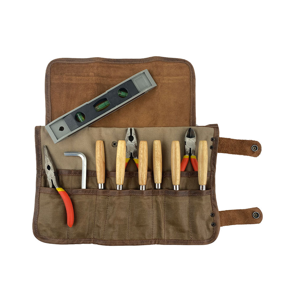 Hide & Drink's Barber Tool Roll presents a Snap Tool Roll Up Bag with 14 Slots, designed for easy organization of scissors & screwdrivers. Made from durable Full Grain Leather, this portable carry case emphasizes StockyardX's small batch production, artisan craftsmanship, hand cut, hand sewn, and fire branded in La Antigua Guatemala & Oaxaca Mexico.