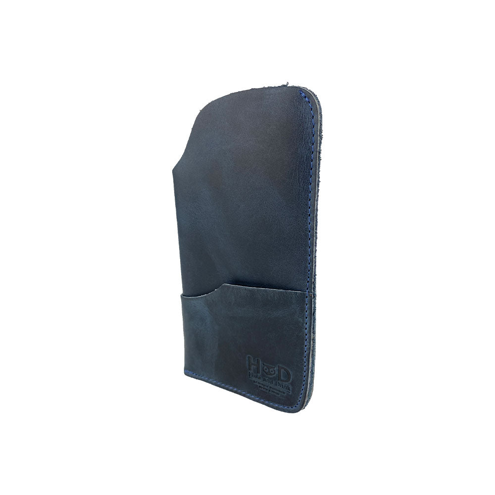 The Hide & Drink Sunglass Case & Wallet depicted in its practical use. This Rustic Sunglasses Case & Wallet, made from premium Full Grain Leather, serves as an essential eyeglasses sleeve for travel, expertly crafted in La Antigua Guatemala & Oaxaca Mexico.