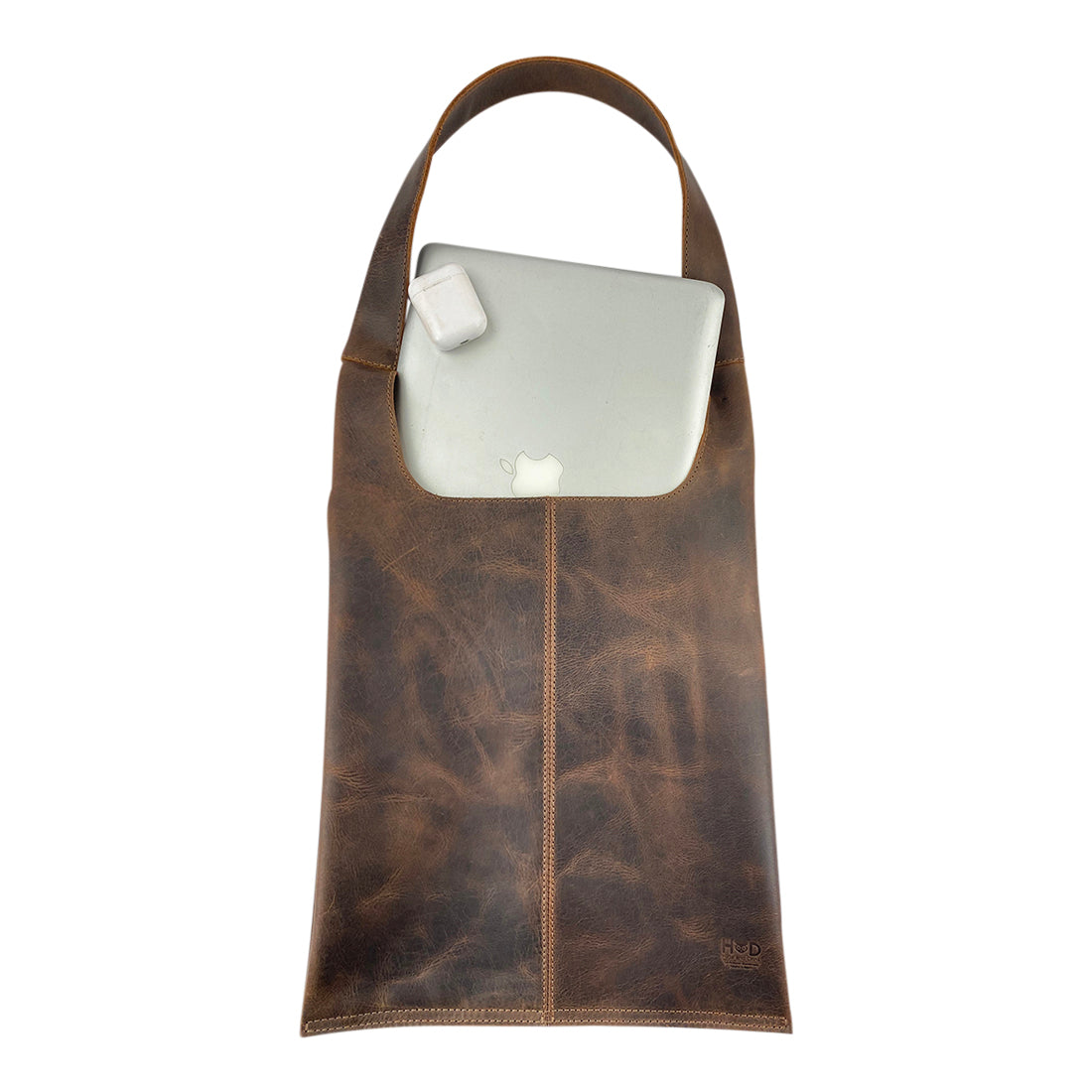 Shoulder Bag for Laptop by Hide & Drink with a laptop inside, demonstrating its spacious interior made from durable full grain leather. This messenger bag is ideal for MacBook Air/Pro owners, crafted with care in Oaxaca Mexico.