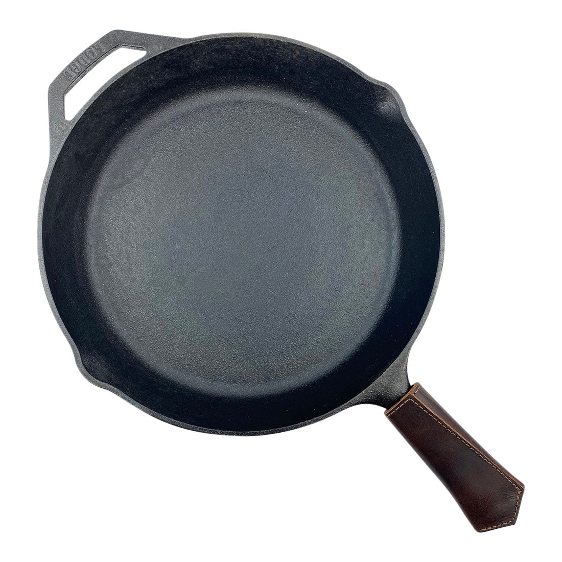 Hide & Drink Hot Pan Handle Cover with dimensions displayed, illustrating its compact size made of durable full grain leather. Handcrafted with care in a small batch production process, emphasizing artisan skill from La Antigua Guatemala & Oaxaca Mexico.