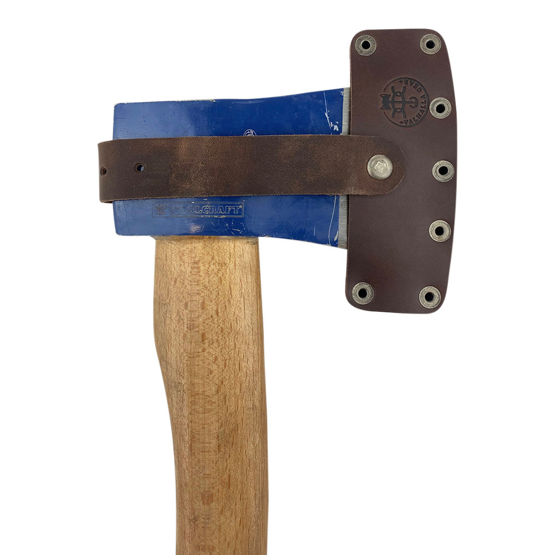 Lumberjack Axe Head Sheath by Valhalla Gear, worn on an axe, highlighting the craftsmanship of full grain leather. This Handmade from Full Grain Leather - Protector Case ensures the safety of your blade, making it a crucial camping accessory. Ideal for lumberjack outdoor work, this Artisan product is hand cut, hand sewn, fire branded, and created in La Antigua Guatemala & Oaxaca Mexico.