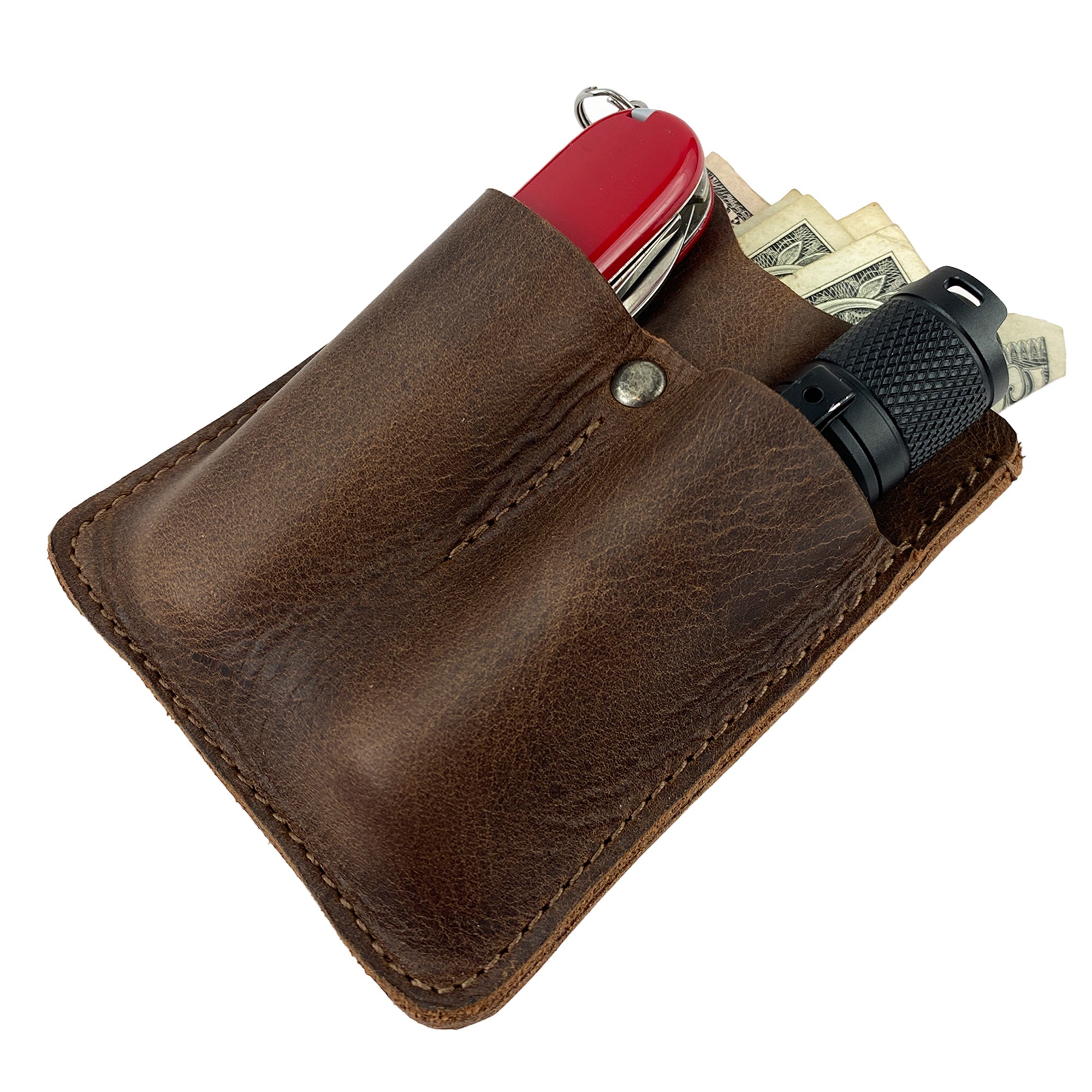 The Hide & Drink Card Holder with Small Tool Slots displaying cash alongside tools. This handmade leather card holder is perfect for keeping small tools and essentials organized, reflecting quality artisan craftsmanship from La Antigua Guatemala.