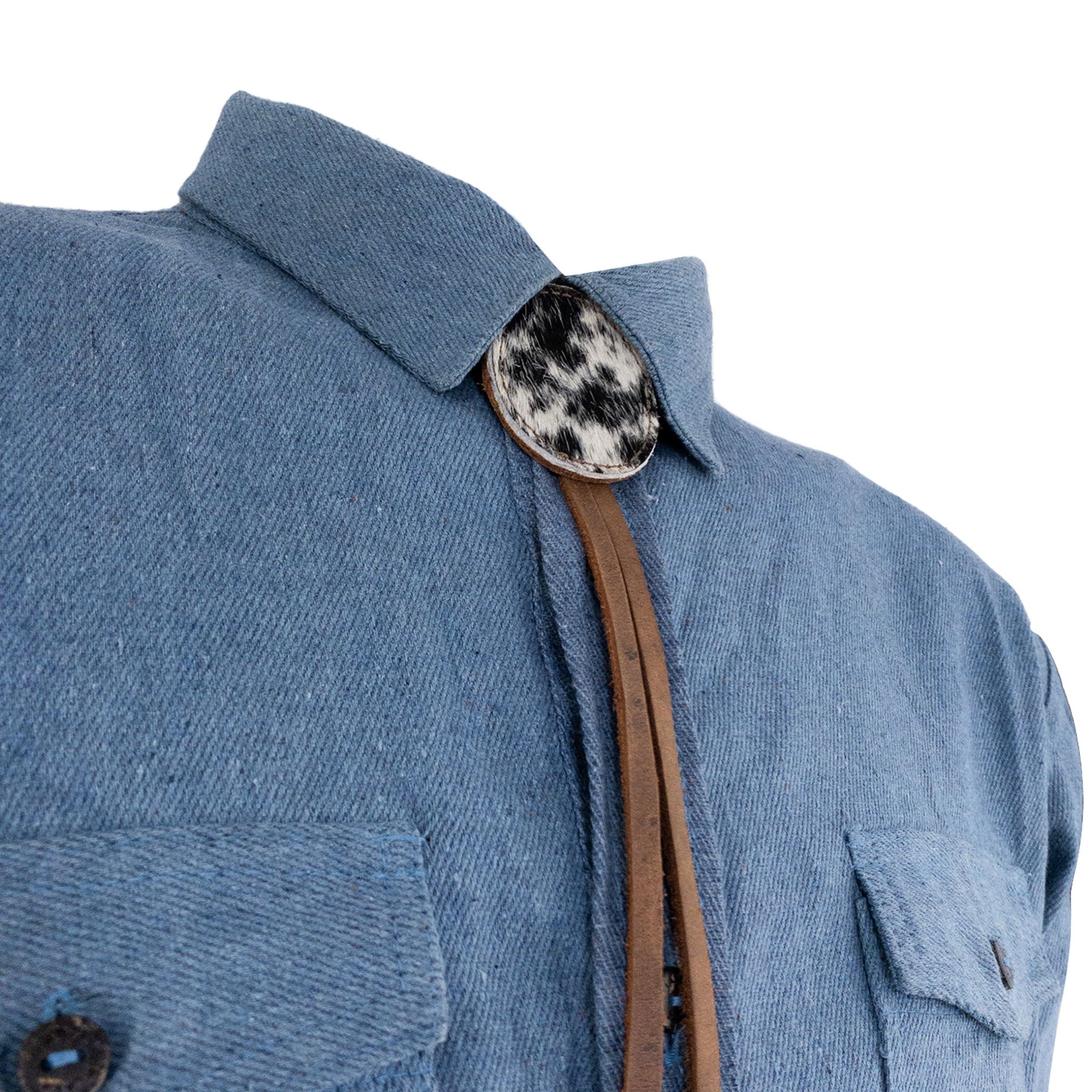 Cowboy Bolo Tie from Western Leather Works highlighting its round shape and crafted from full grain leather. A trendy necktie accessory that signifies artisan craftsmanship, embodying small batch production, handmade in La Antigua Guatemala & Oaxaca Mexico.