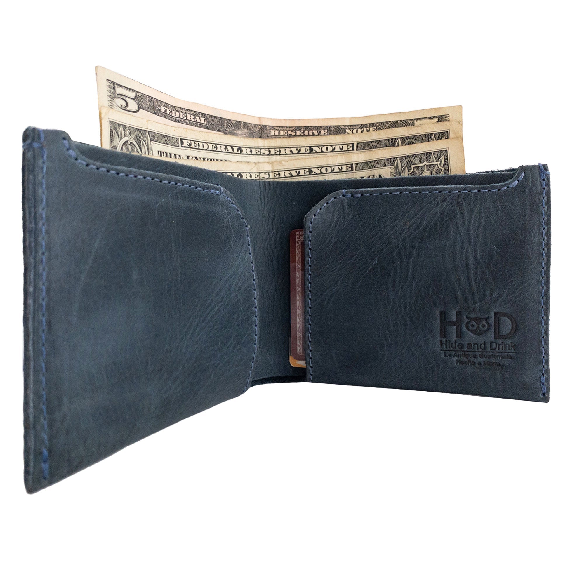 Wide shot of the navy blue Hide & Drink Classic Wallet measuring featured dimensions for a compact and practical design. Classic Wallet, Card Organizer, Money Holder, Vintage Pocket, Travel Accessories, Full Grain Leather, StockyardX, Small Batch Production, Hand Cut, Hand Sewn, Fire Branded, Artisan, Handmade in La Antigua Guatemala & Oaxaca Mexico.