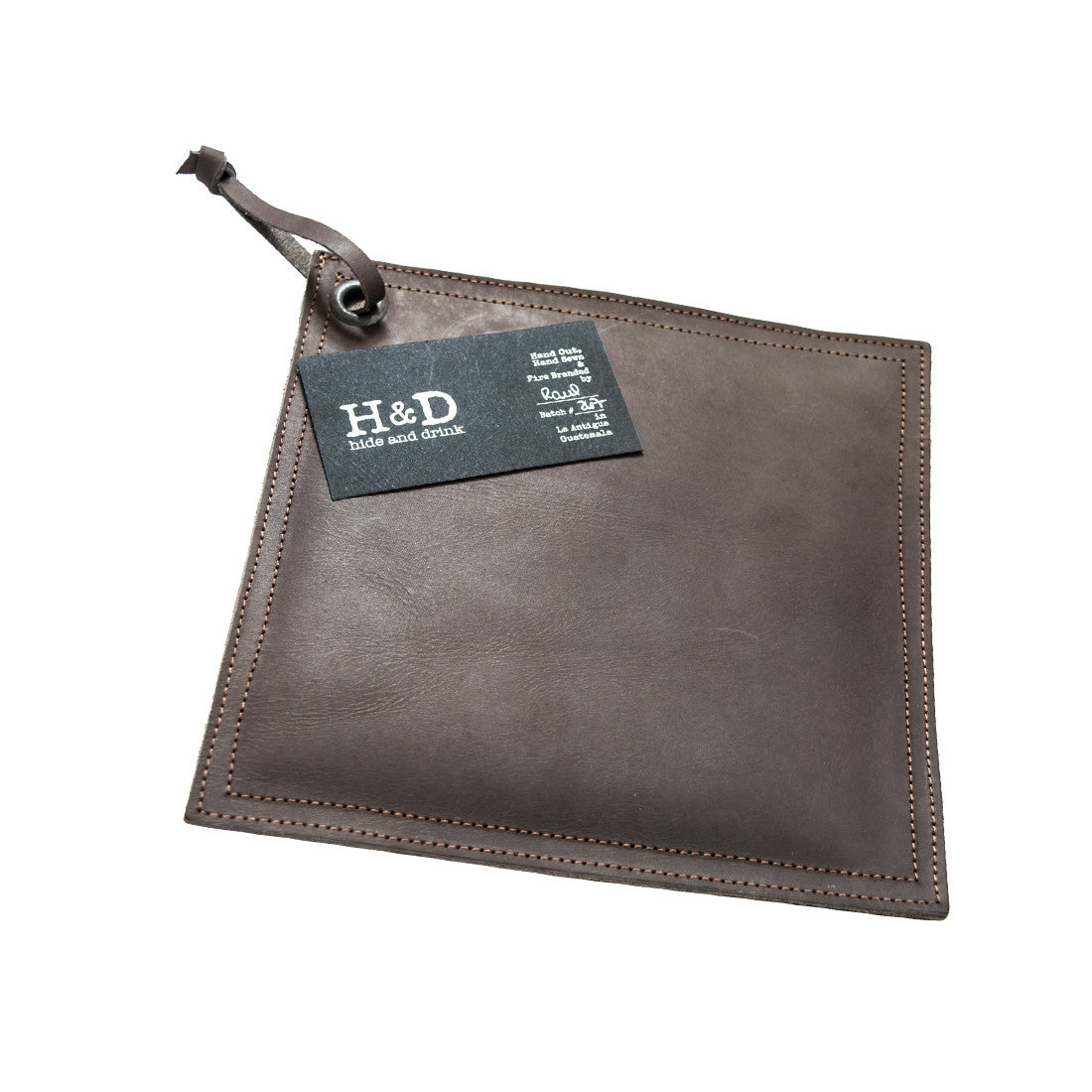 Side view of the Hide & Drink Pot Pad, highlighting its handcrafted design and utility. This rustic hot pot pad is perfect for kitchen use.