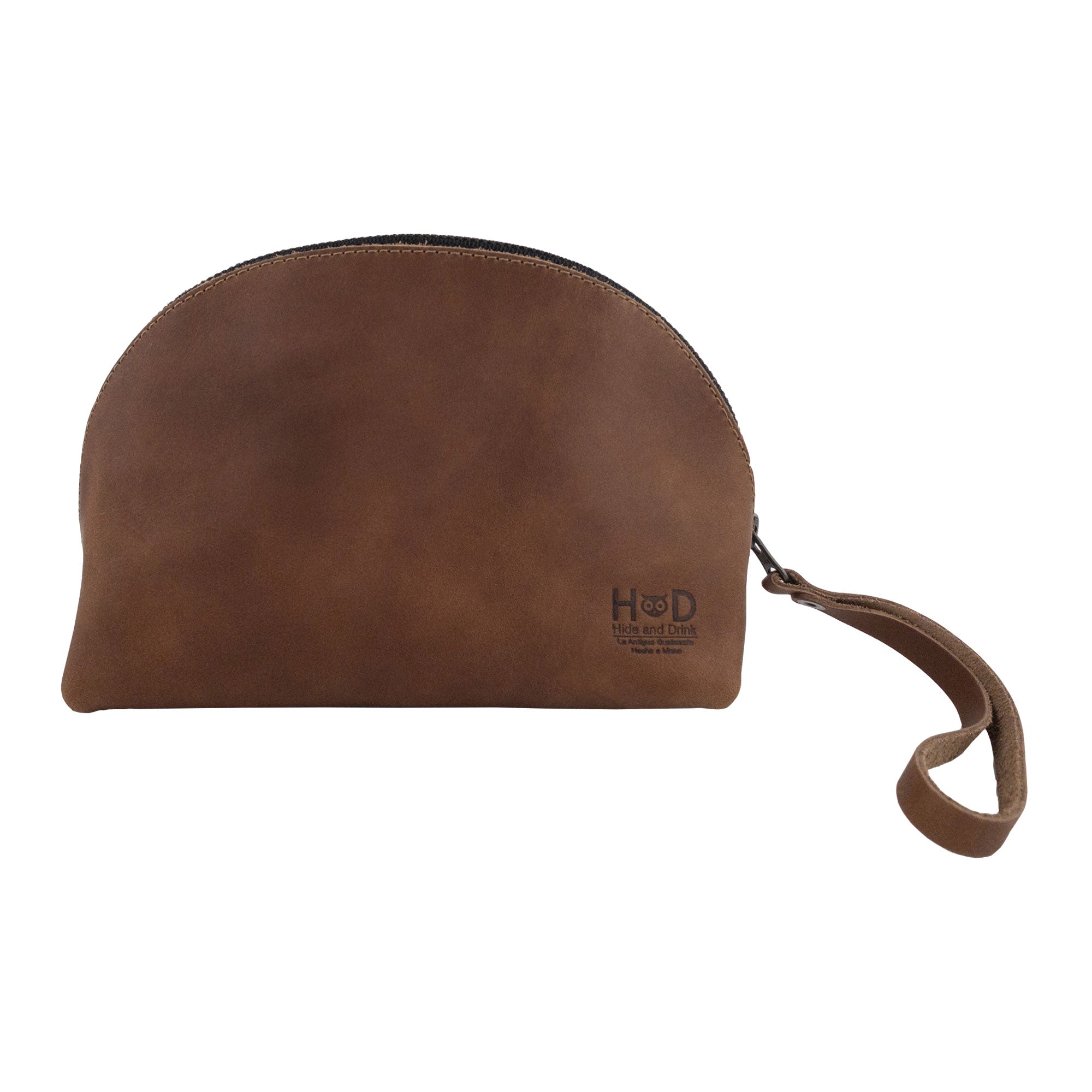 Dimensions and features of the Accessory Pouch Organizer Hand Bag by Hide & Drink. Made from brown full grain leather, this Cosmetic Travel Organizer with Hand Strap for Women acts as an efficient Makeup Bag and Classic Handbag, highlighting small batch production in La Antigua Guatemala & Oaxaca Mexico.