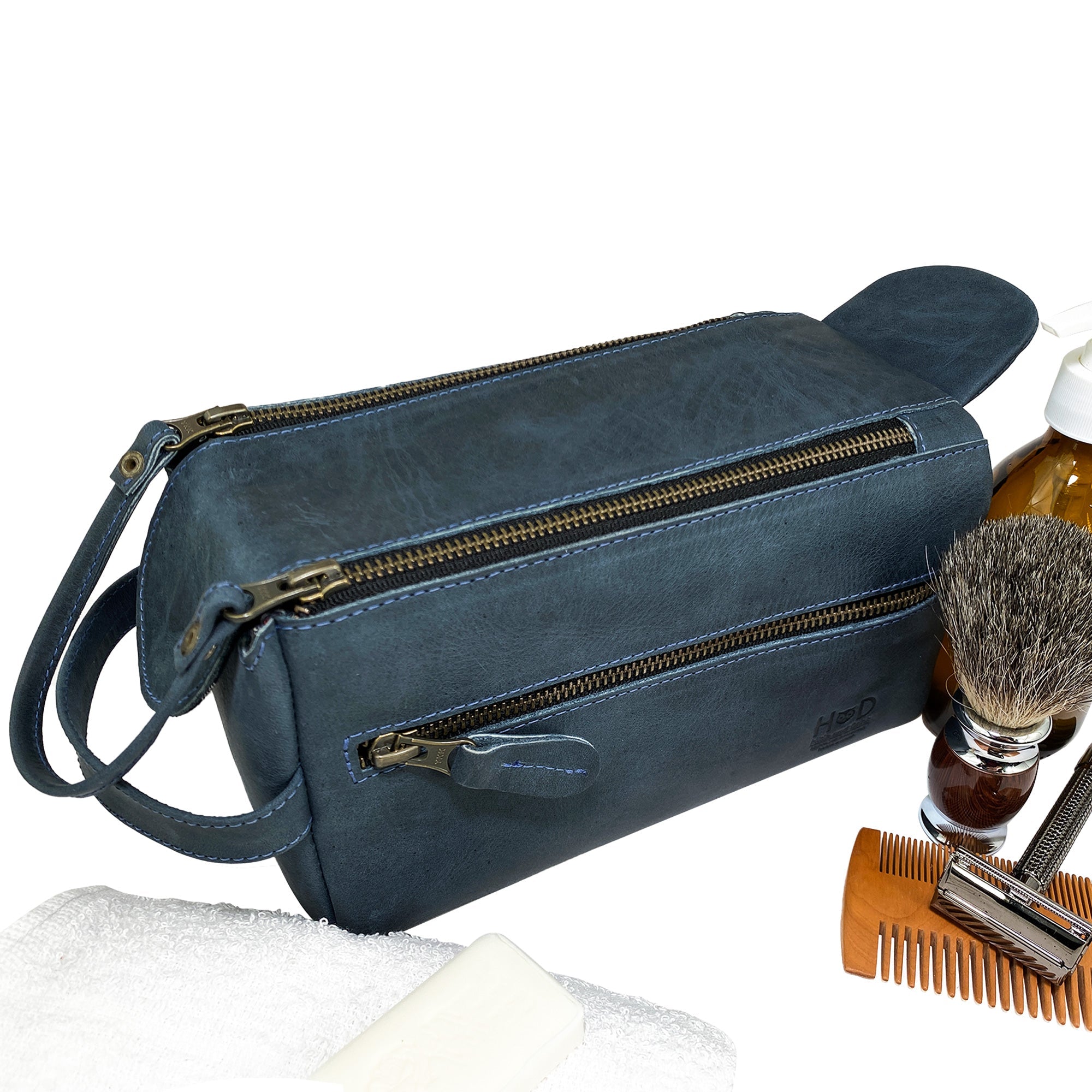 Bottom view of the blue Hide & Drink Toiletry Bag, showcasing its quality craftsmanship. This Full Grain Leather Toiletry Bag is ideal as a Hand Bag or Dopp Kit Organizer for any occasion. StockyardX, Handmade, S.