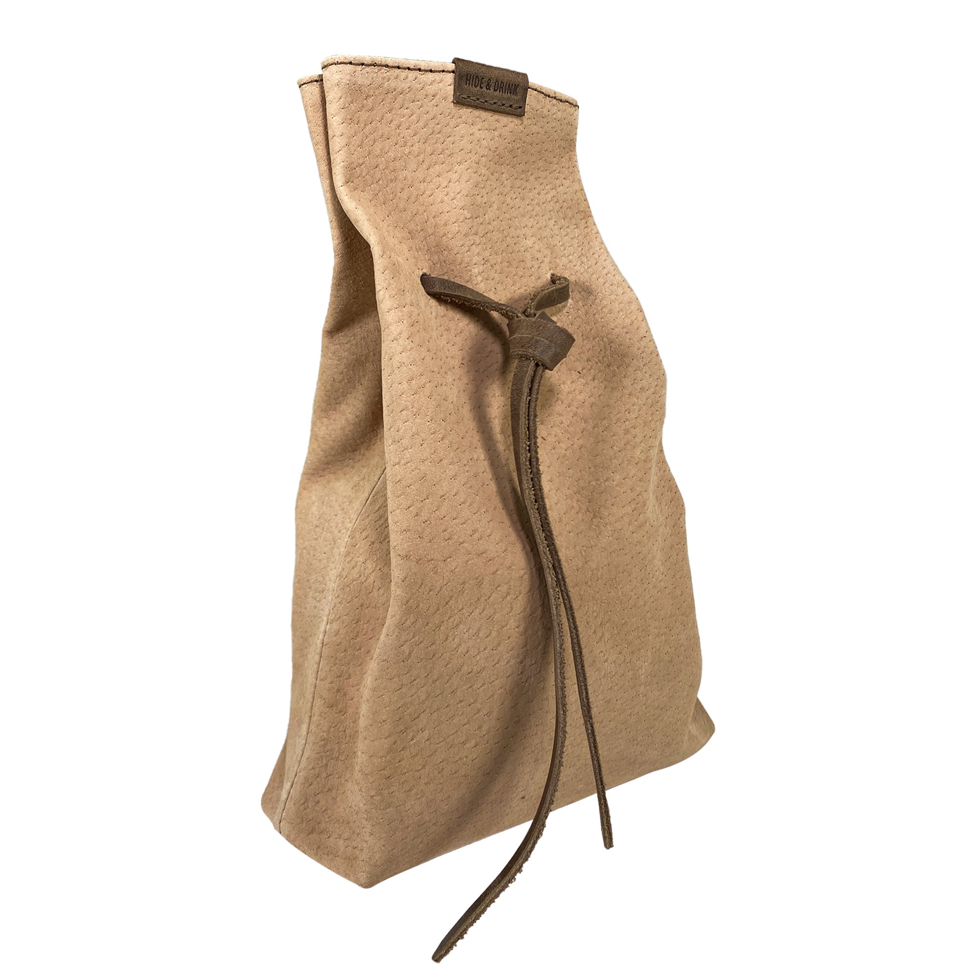 Hide & Drink's Drawstring Sack (2 pack) shown from the side, demonstrating its practical size and structure for carrying essentials. Drawstring Sack (2 pack) Handmade from Sheepskin and Full Grain Leather, StockyardX, Small Batch Production, Hand Cut, Hand Sewn, Fire Branded, Artisan, Handmade in La Antigua Guatemala & Oaxaca Mexico.