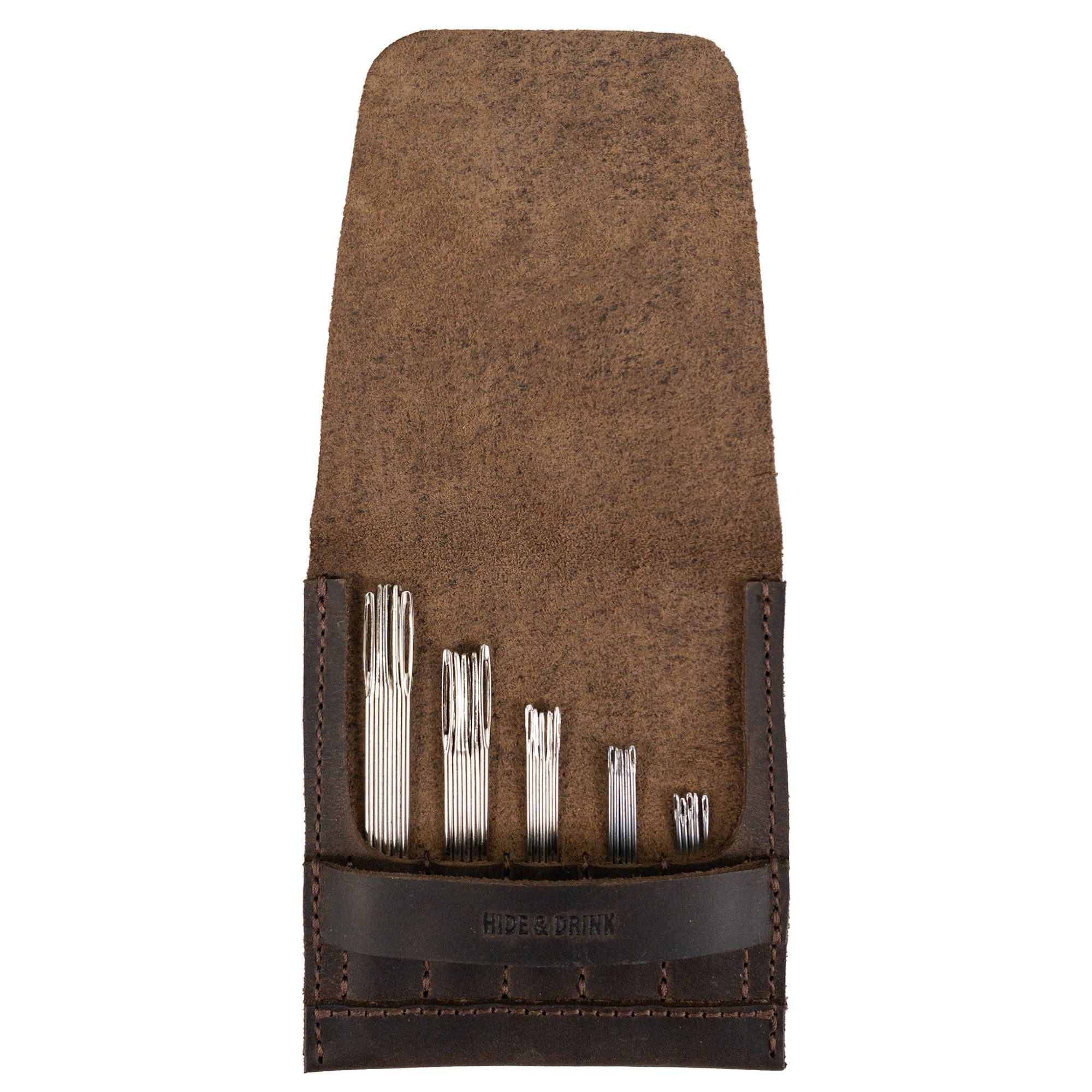 Open view of the Needle Case by Hide & Drink displaying various compartments for needles. Made from Full Grain Leather, this handmade piece represents small batch production and the skilled craftsmanship of artisans in La Antigua Guatemala & Oaxaca Mexico.