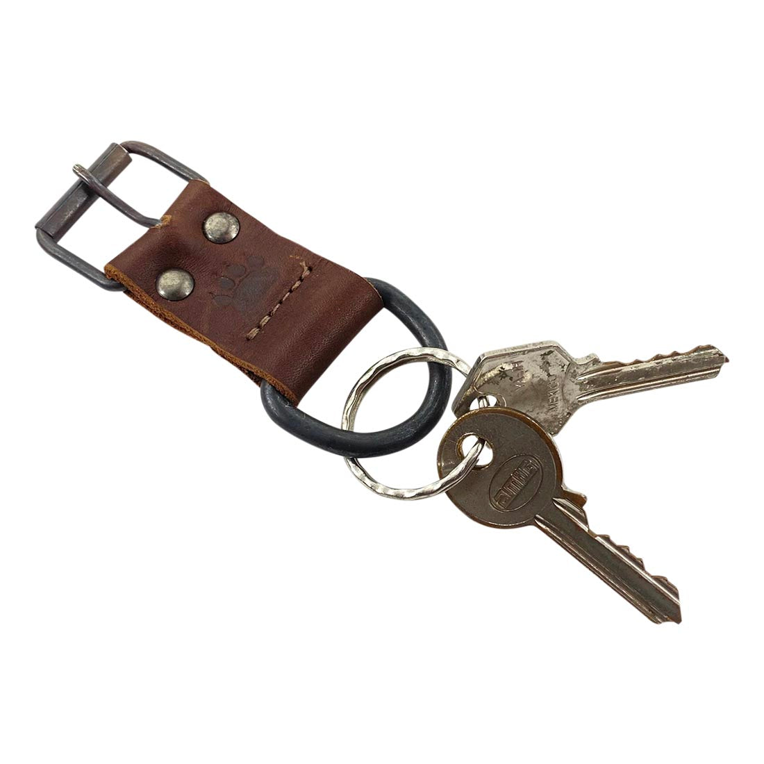 Taco Dog's Dog Collar Keychain featuring keys, emphasizing its durable design and artisan craftsmanship. A perfect functional and lightweight accessory for dog lovers, this handmade keychain is made from natural full grain leather and reflects the quality of small batch production in La Antigua Guatemala & Oaxaca Mexico.