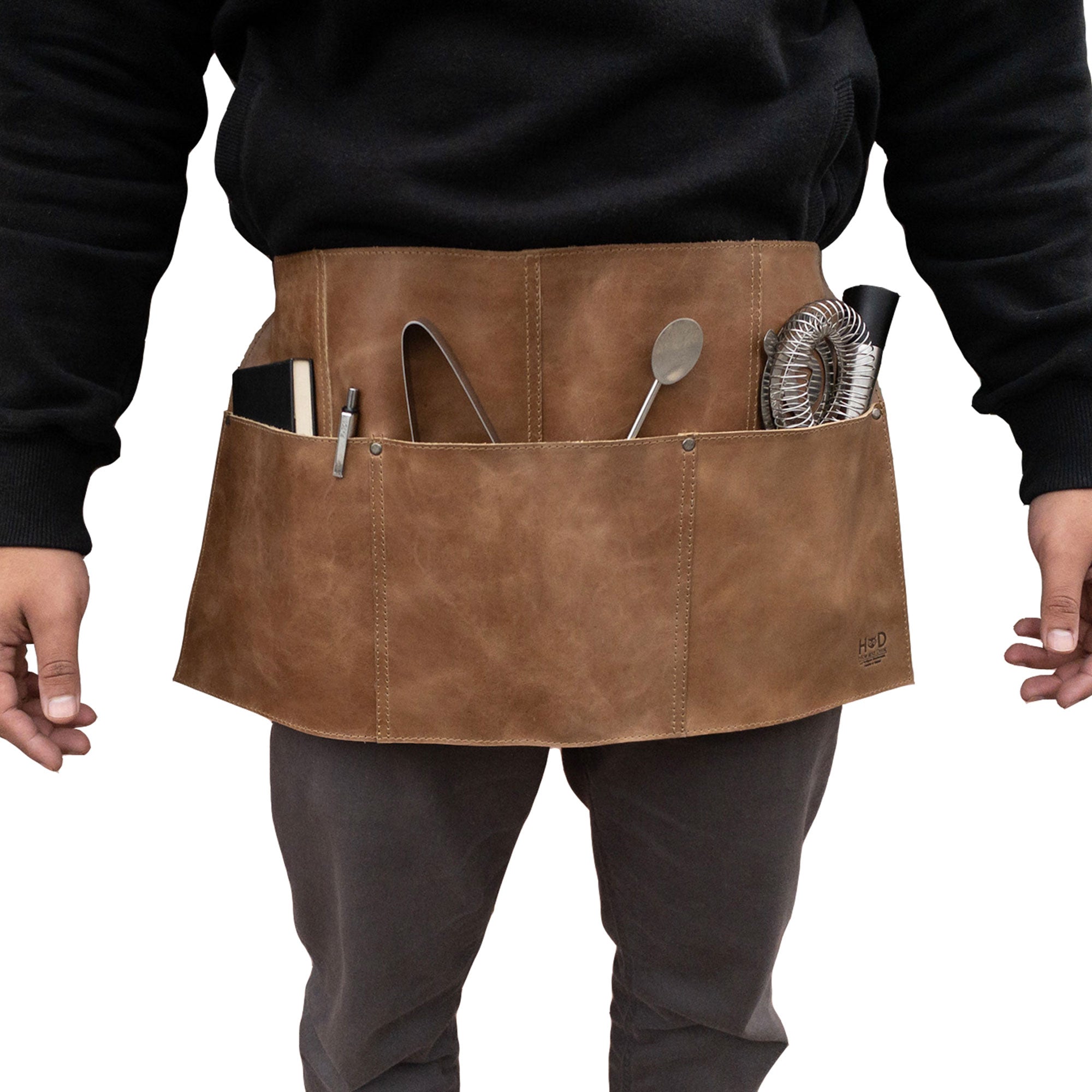 Hide & Drink Barista Leather Waist Apron displayed in a functional way with riveted pockets, making it perfect waitress and waiter accessories, crafted from full grain leather in La Antigua Guatemala & Oaxaca Mexico.
