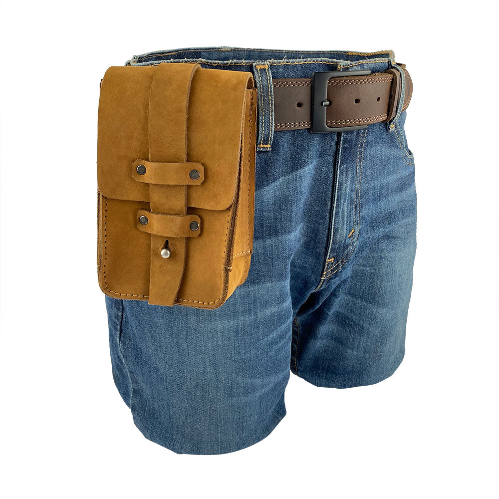 Bartender Fanny Pack by Hide & Drink worn on denim shorts, providing a stylish way to carry bar tools. This handmade fanny pack is crafted from thick full grain leather and perfect for bartenders, made in La Antigua Guatemala.
