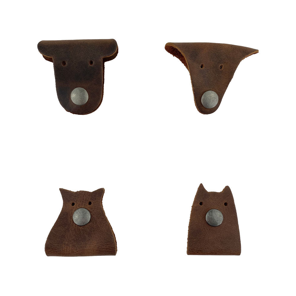 Furry Friends Cord Keeper (4-Pack), with charming designs, made from full grain leather by Hide & Drink for organized and neat cord storage. Furry Friends 4-Pack Cord Keeper (Cord Clam), Full Grain Leather, StockyardX, Small Batch Production, Hand Cut, Hand Sewn, Fire Branded, Artisan, Handmade in La Antigua Guatemala & Oaxaca Mexico.