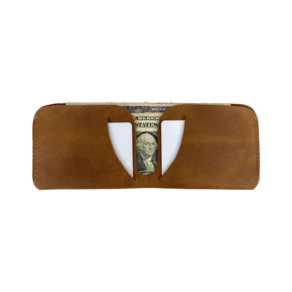 Side view of the Hide & Drink Minimal Wallet demonstrating its practical design in Full Grain Leather. A quintessential Classic Slimfold Wallet that serves as an efficient Card Organizer Holder and Travel Accessory, made through Small Batch Production by artisans in La Antigua Guatemala & Oaxaca Mexico.