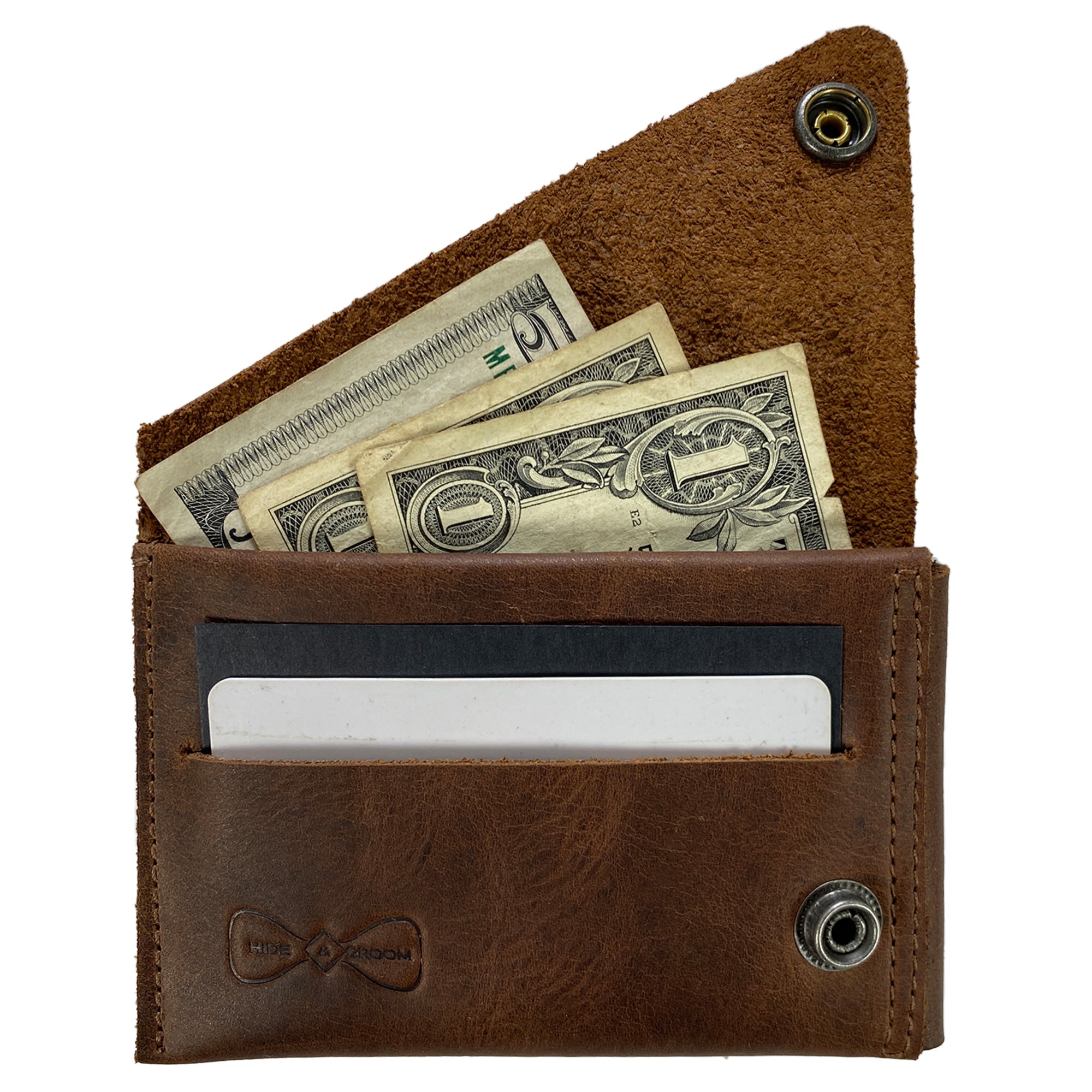 The Hide & Groom Minimalist Wallet filled with cash and cards, demonstrating its functionality and sleek design. This wallet is crafted from full grain leather, emphasizing quality and style from artisans in La Antigua Guatemala. Minimalist Wallet - Business Card & Money Holder, Stylish Compact Money Organizer, Full Grain Leather, StockyardX, Small Batch Production, Hand Cut, Hand Sewn, Fire Branded, Artisan, Handmade in La Antigua Guatemala & Oaxaca Mexico.