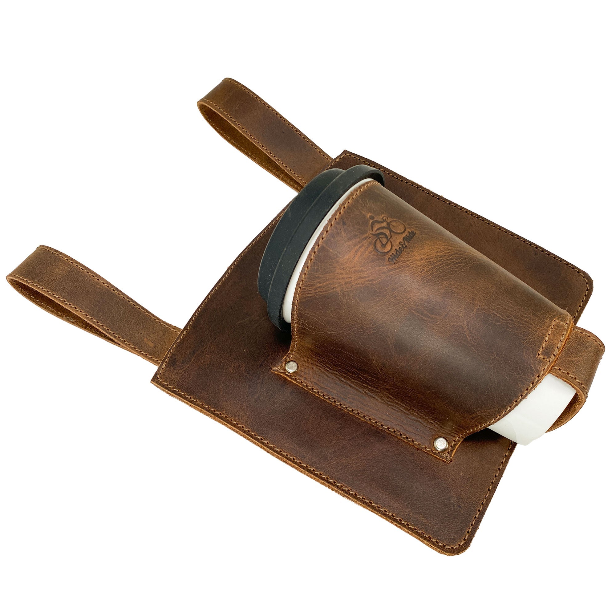 Side view of the Bike Handlebar Cup Holder by Hide & Ride displaying a coffee cup and leather finish, ideal for bikers on the go. Bike Handlebar Cup Holder Handmade from Full Grain Leather - Beverage Pouch for Commuters, Minimalist Bikers, Cyclers, Urban Nomad, Full Grain Leather, StockyardX, Small Batch Production, Hand Cut, Hand Sewn, Fire Branded, Artisan, Handmade in La Antigua Guatemala & Oaxaca Mexico.