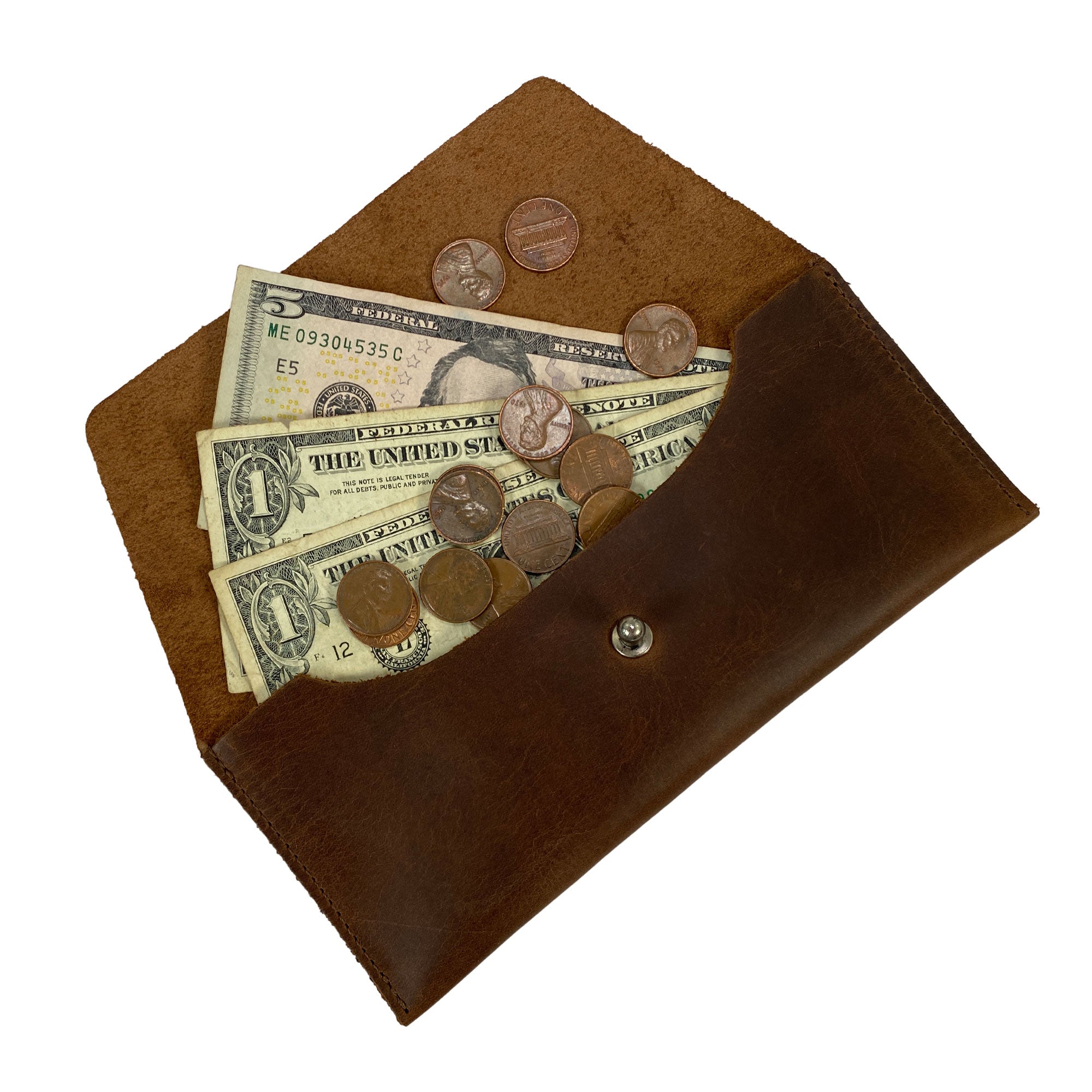 Open view of Heather's Long Utility Pouch displaying cash and coins inside. This stylish wallet not only keeps essentials organized but also showcases a vintage, minimalist style. Made of full grain leather by StockyardX, each piece is handcrafted in small batches, ensuring quality with hand cut, hand sewn, and fire branded details from La Antigua Guatemala.
