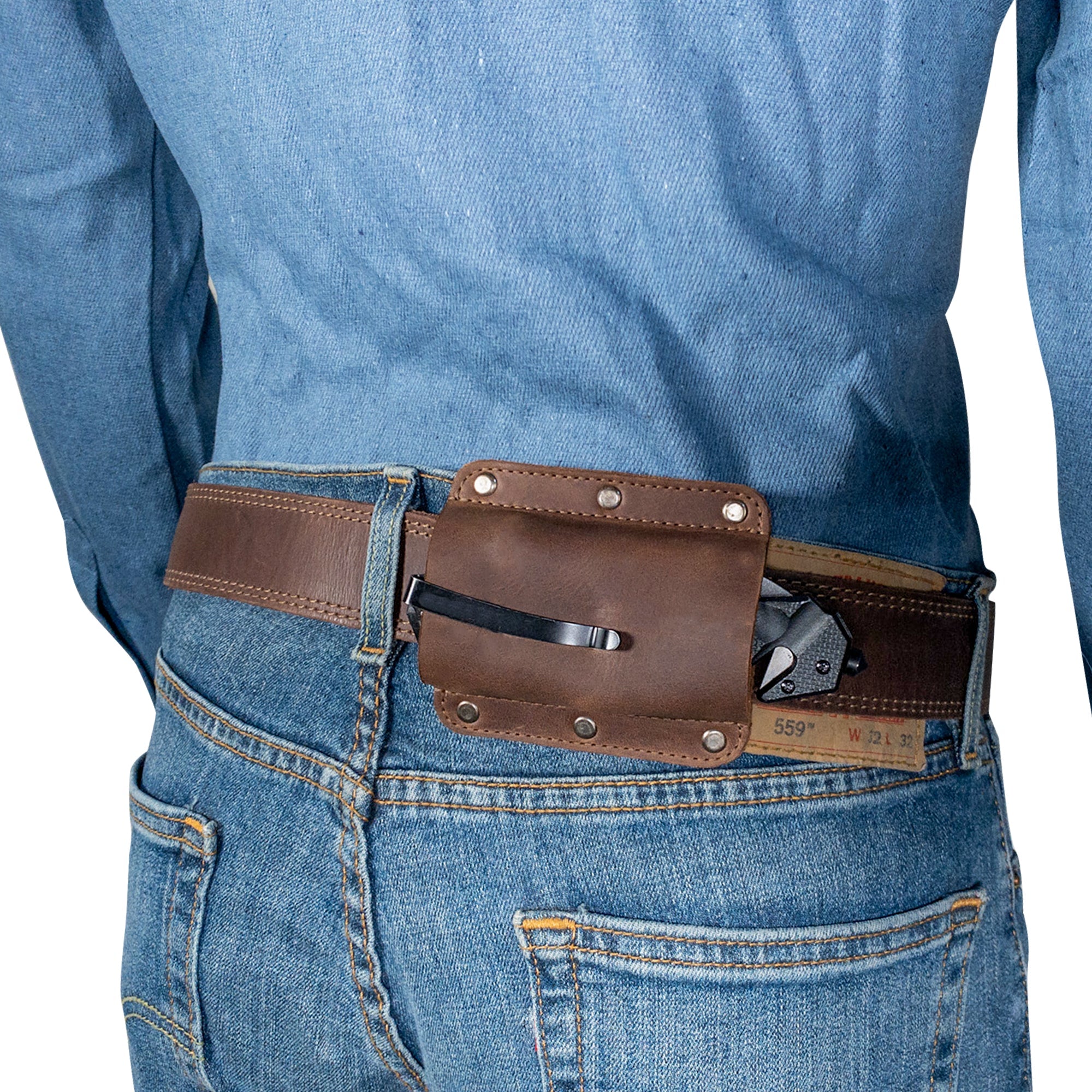 Lifestyle shot of a person wearing a Knife Sheath for Belt by Valhalla Gear, securely affixed to their belt. This full grain leather Knife Holster - Horizontal Holder is ideal for camping & outdoor activities, made with care through hand cut and hand sewn techniques by skilled artisans.