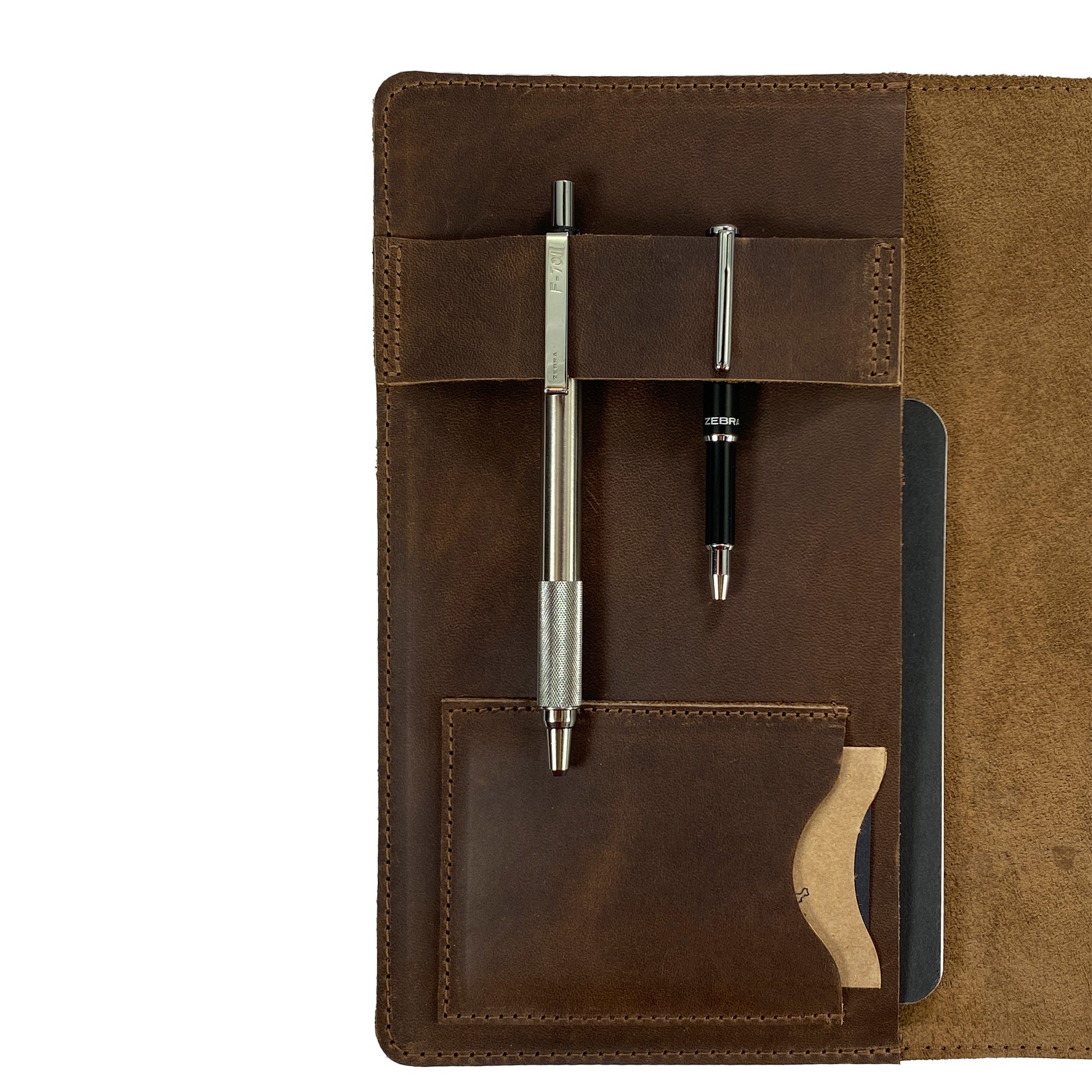 Focused view of pen slots inside the Leather Worx Notepad Cover, emphasizing the handmade quality and attention to detail. This Notepad Cover ensures a sophisticated organization solution with its sturdy, full grain leather, made with artisanal craftsmanship in La Antigua Guatemala.