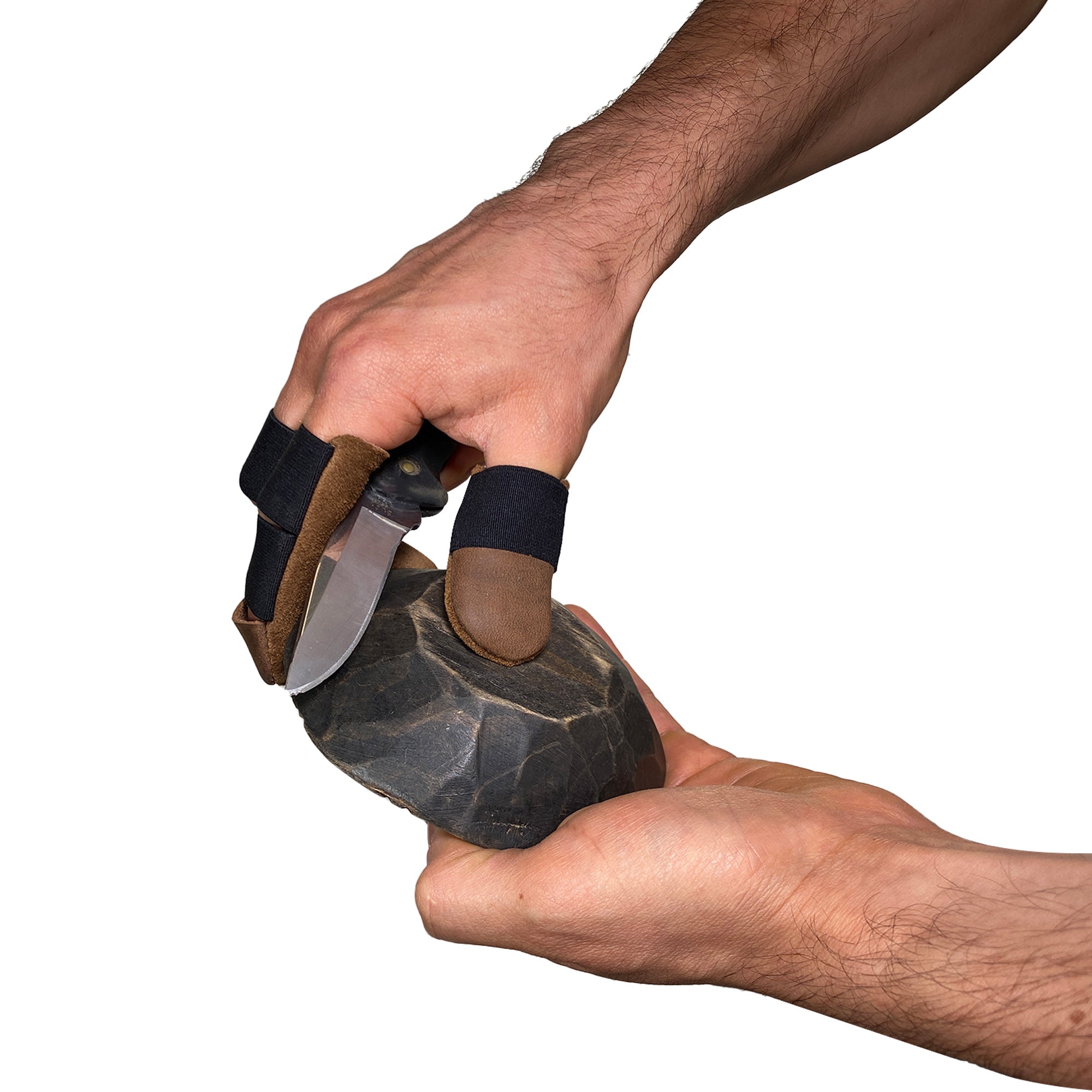 A person skillfully using Toolshed Hide Thumb and Finger Guards (3 Pieces) to protect their fingers while working, providing comfortable protection. These full grain leather guards are part of the StockyardX collection, representing small batch production with an artisan touch through their hand cut and hand sewn methods, crafted in La Antigua Guatemala & Oaxaca Mexico.