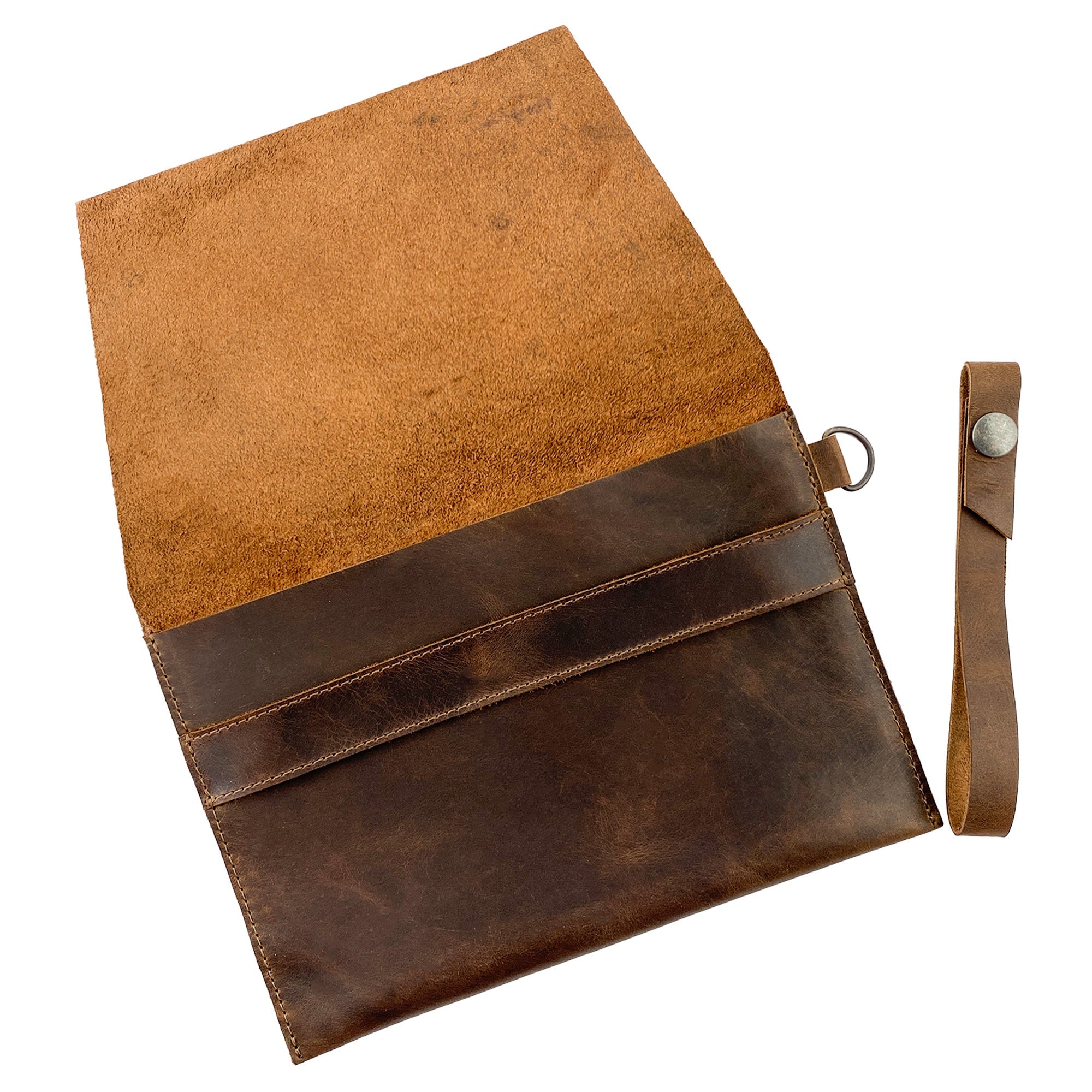 Open view of Heather's Vintage Clutch Bag highlighting its spacious design with wrist strap. This full grain leather bag, ideal for cards, money, and coins, emphasizes the artisan craftsmanship of small batch production found in La Antigua Guatemala & Oaxaca Mexico.