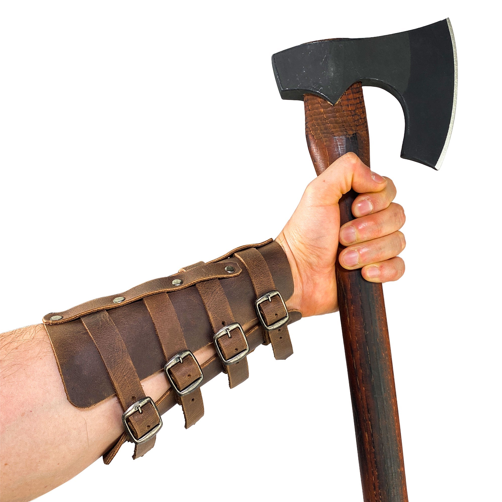 This dynamic image presents the 4 Buckle Bracelet (2 Pack) by Valhalla Gear, worn while gripping an axe. These Viking-style wrist guards, crafted from full grain leather, offer practical protection for archery and showcase the artisan quality of StockyardX from La Antigua Guatemala & Oaxaca Mexico.