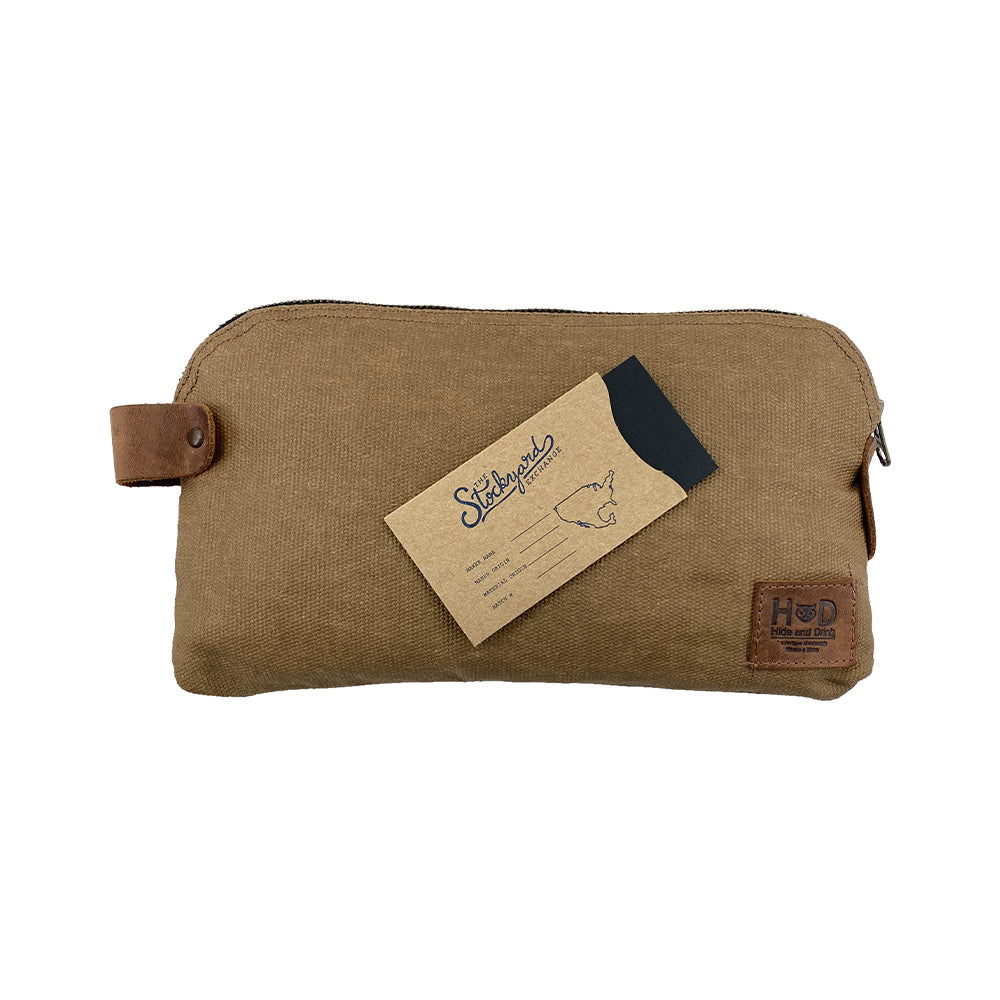 Dopp Kit Utility Bag by Hide & Drink featuring a rugged yet elegant style ideal for travel. This large rustic all-purpose Dopp Kit Utility Bag is made from full grain leather with exceptional artisan details, showcasing hand cut and hand sewn techniques for durability, handmade in La Antigua Guatemala & Oaxaca Mexico.