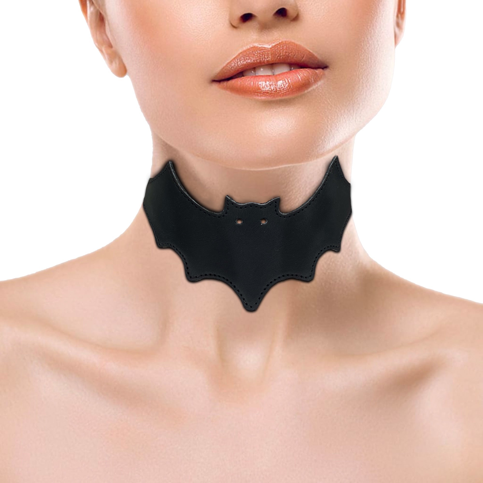 Model wearing the Bat-man Choker by Hide & Play, demonstrating how the bat-shaped collar adds a stylish accent to their outfit. This Bat Choker is an adjustable piece that embodies punk style and artisanal quality.