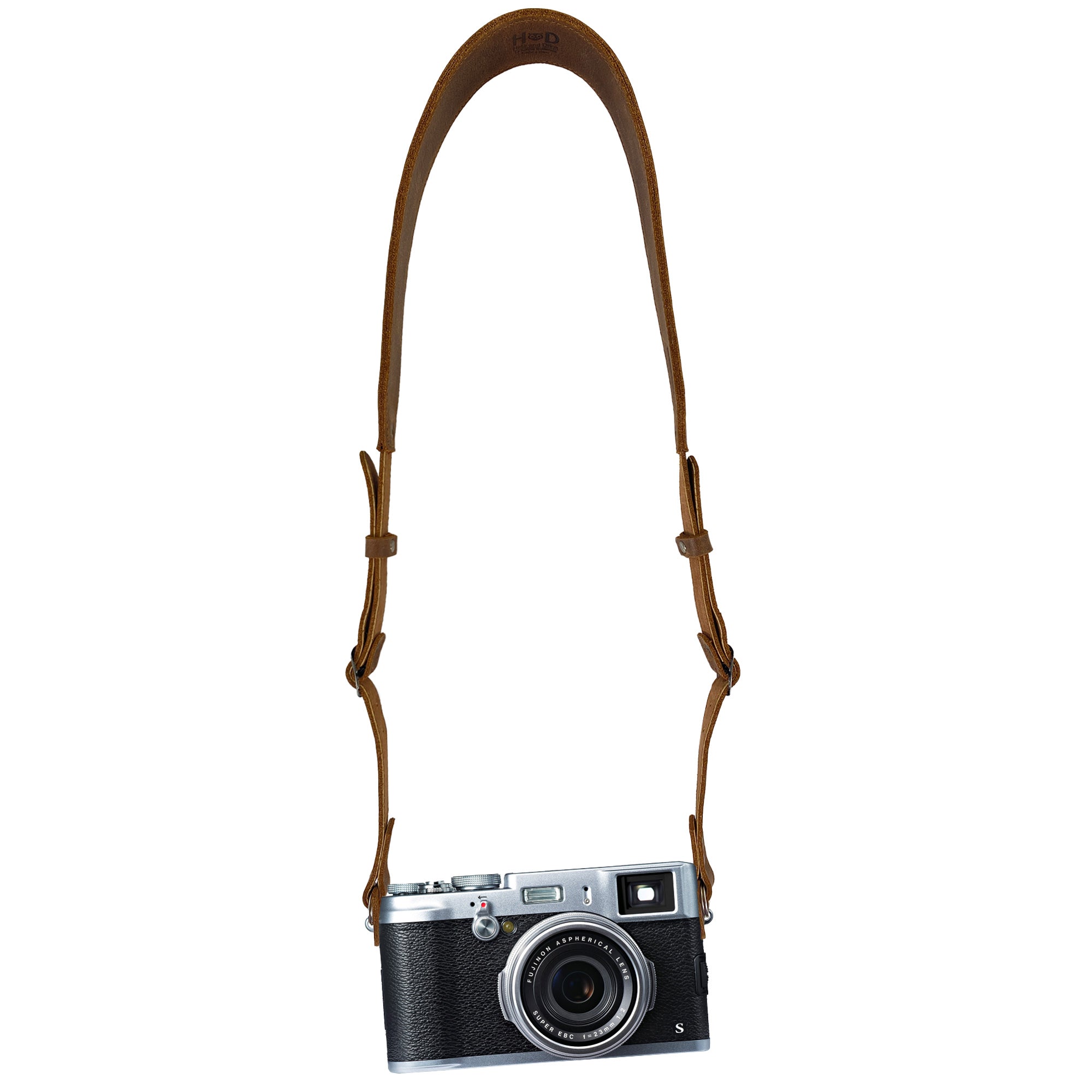 Hide & Drink Rustic Camera Strap modeled with a camera, illustrating its stylish and functional design. Handmade from Full Grain Leather, it's adjustable and perfect for mirrorless and compact cameras—an excellent gift for photographers. StockyardX, Small Batch Production, Hand Cut, Hand Sewn, Fire Branded, Artisan, Handmade in La Antigua Guatemala & Oaxaca Mexico.